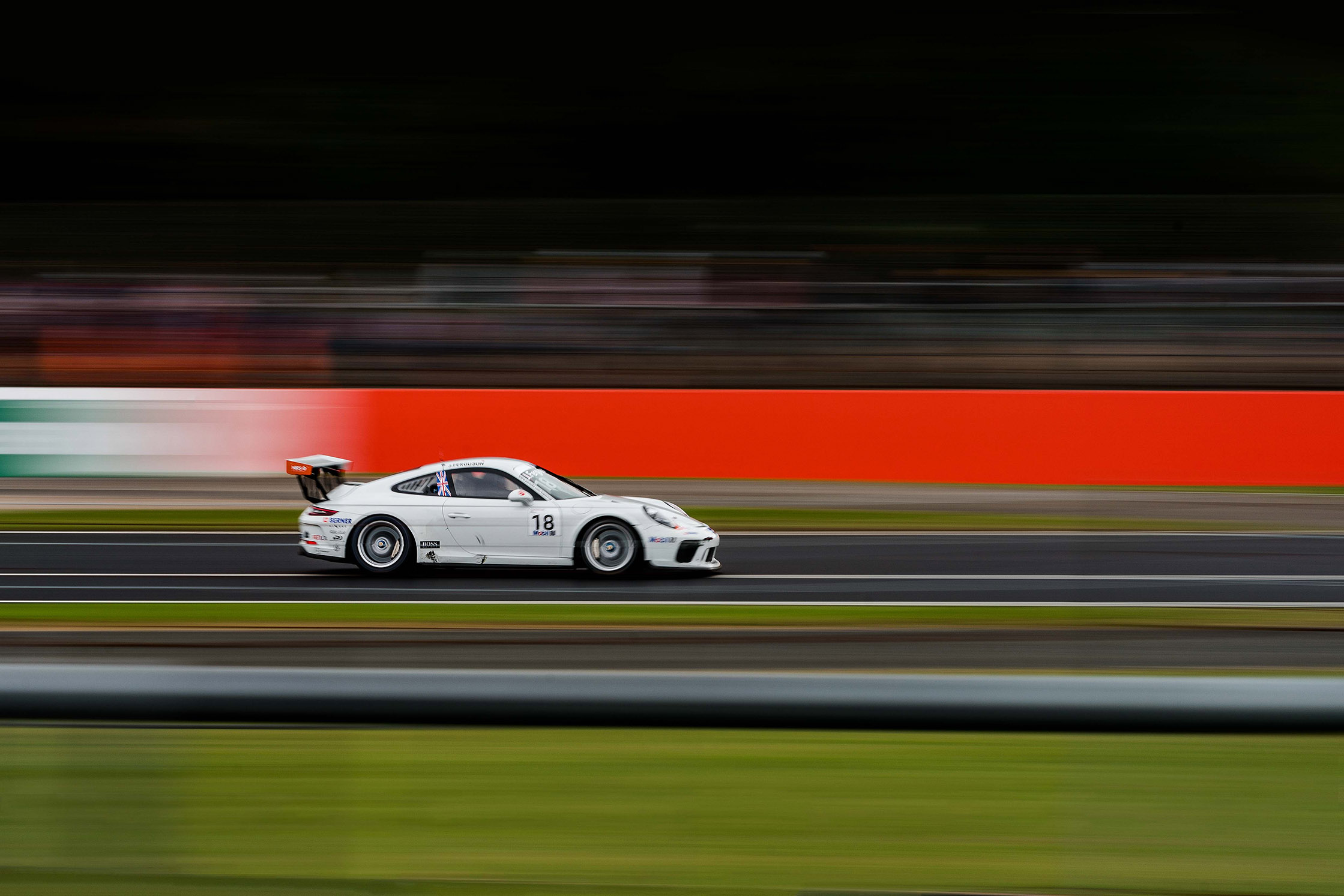 a white race car with motion blur