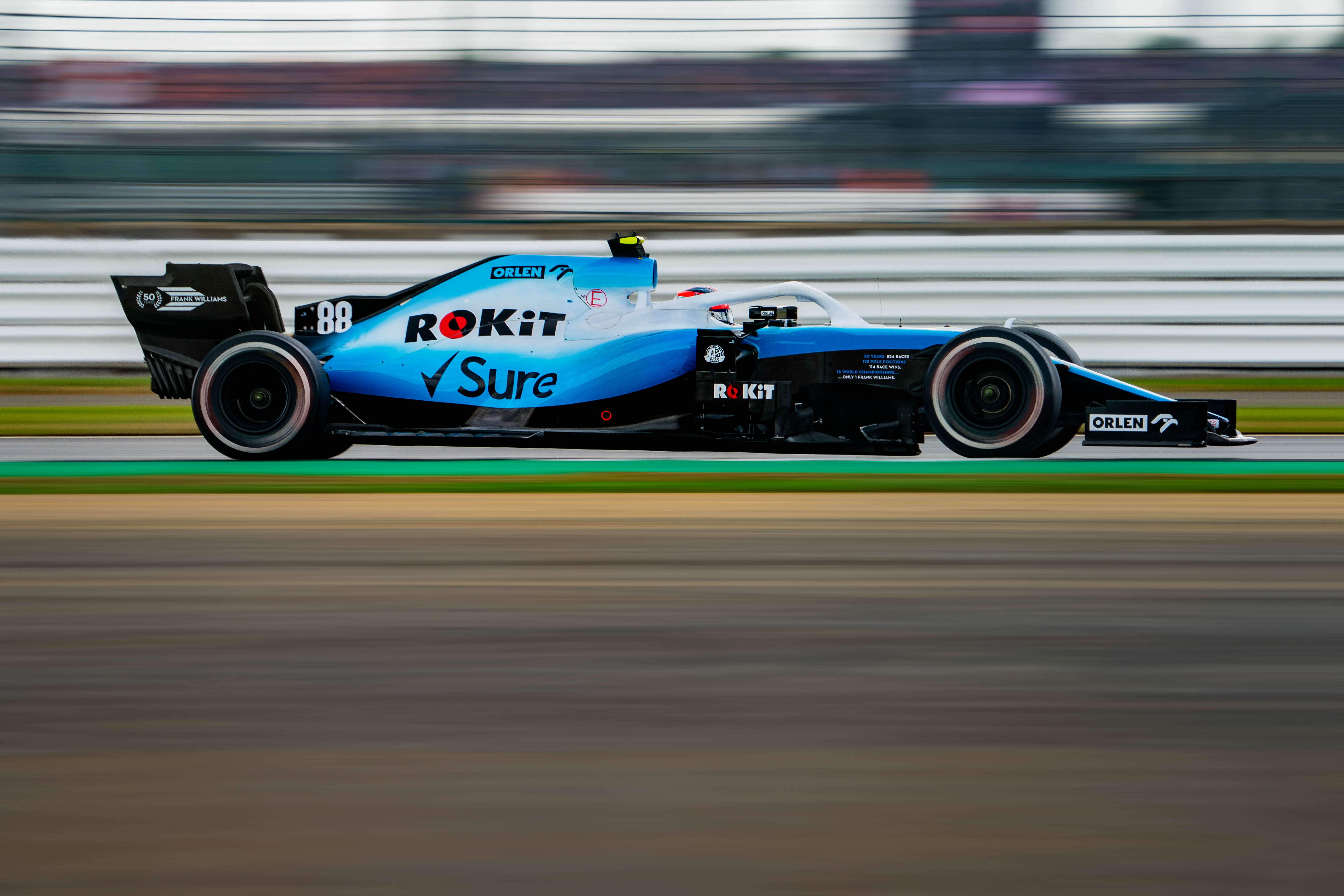 a blue race car with motion blur