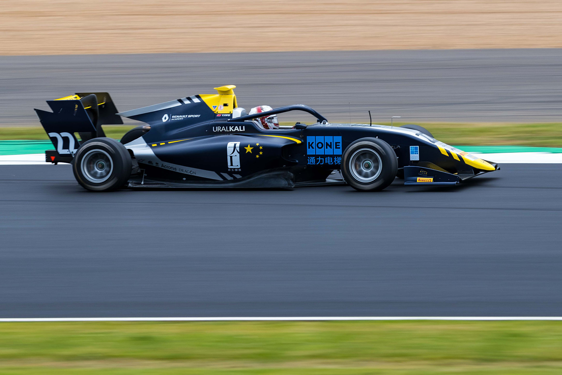 A black, yellow and blue race car