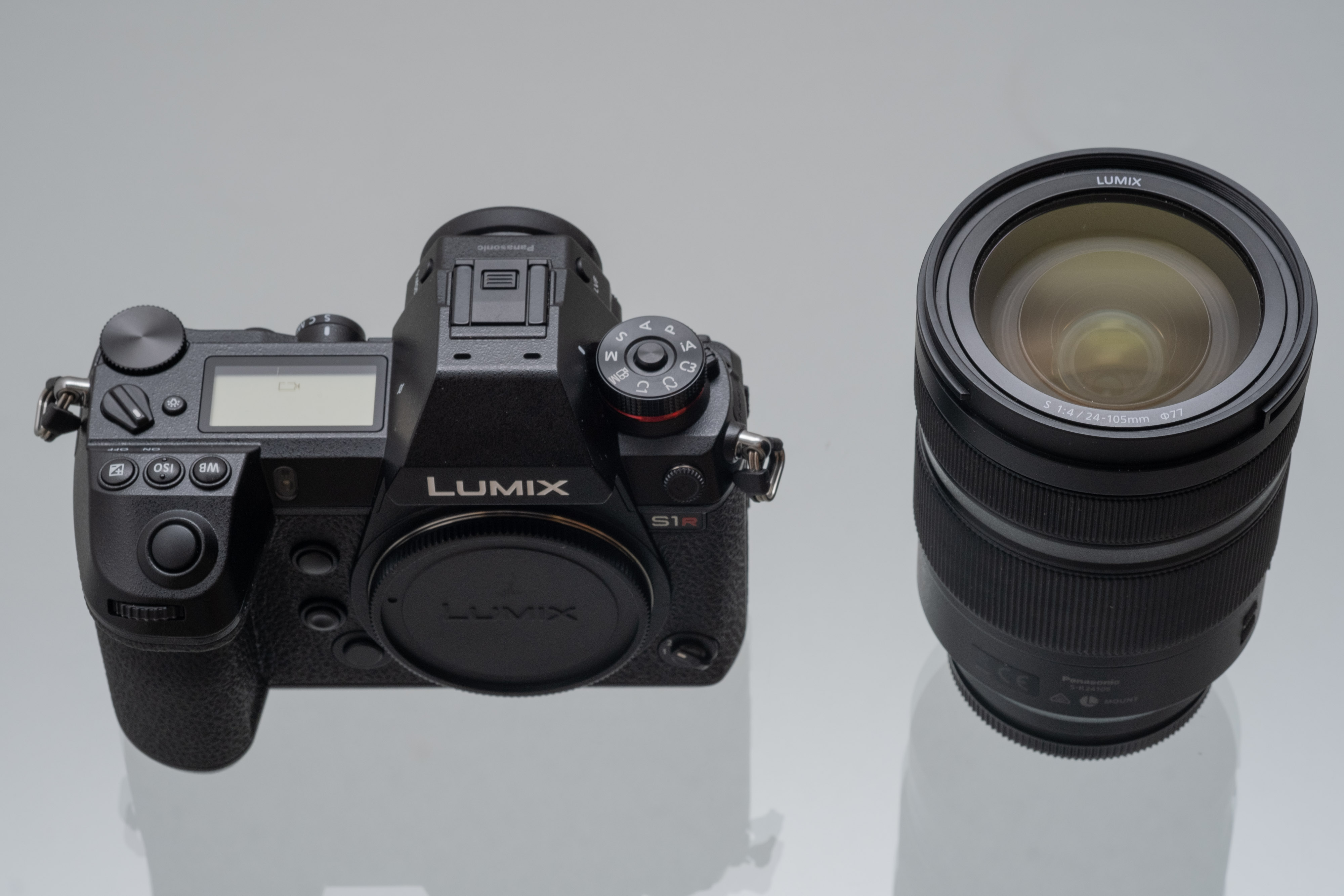 Panasonic S1R and lens on glass table