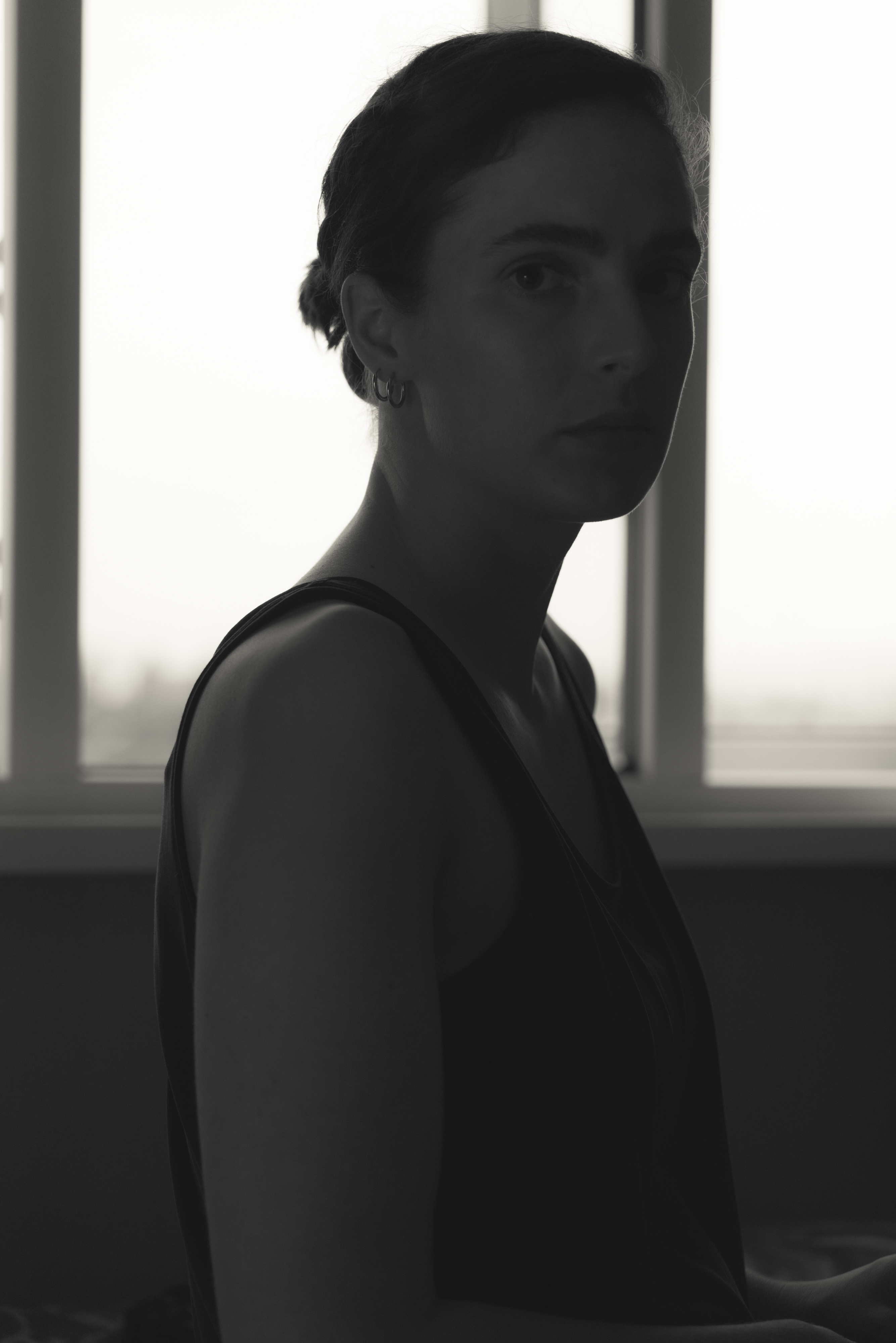 A woman looking stern in black and white