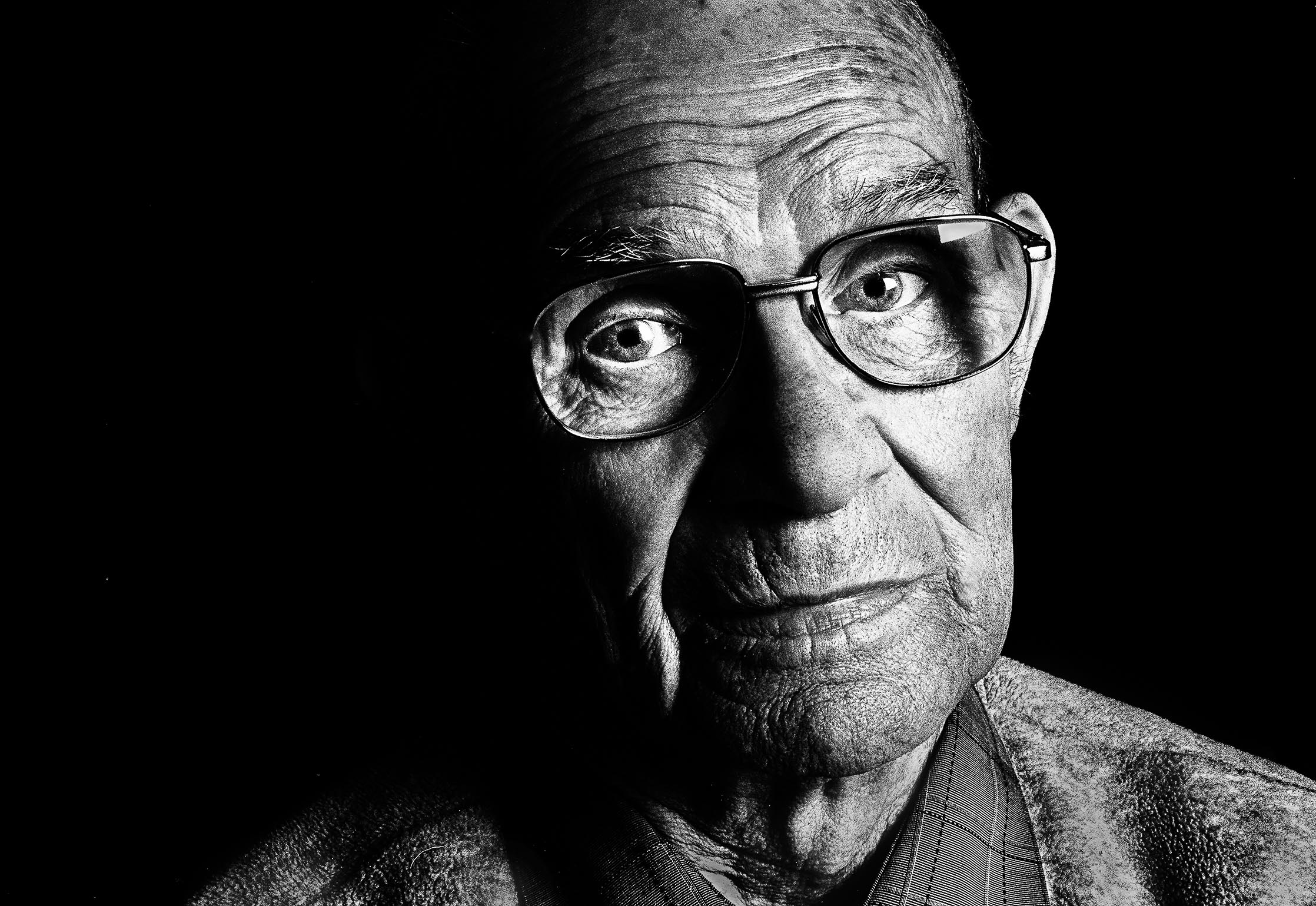 Black-and-white portrait of an elderly man