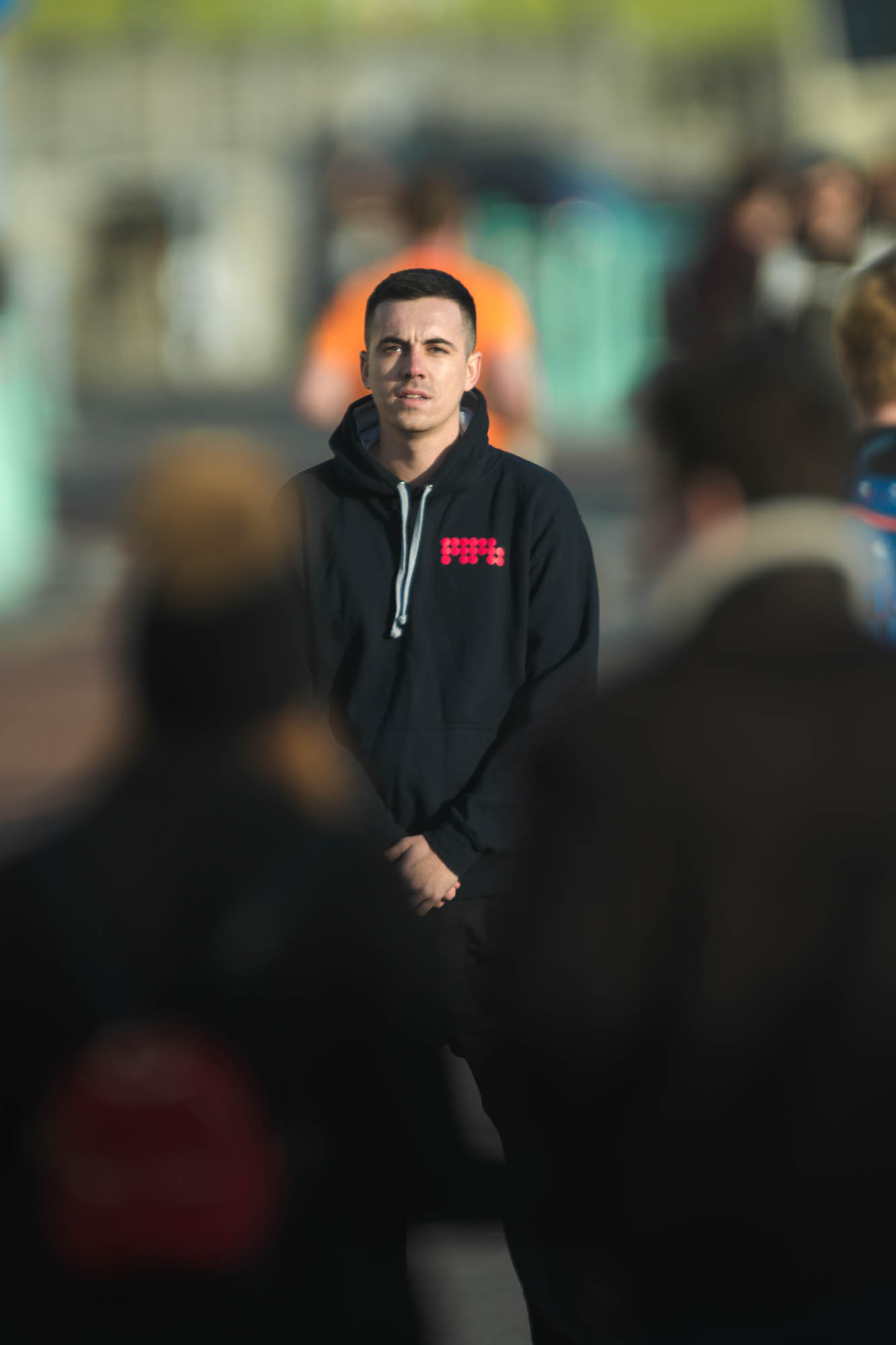 An MPB employee standing in a crowd, photo by Marc Read with the Nikon Z7, Sigma 200-500mm f/2.8 EX APO DG and 2x EX APO teleconverter