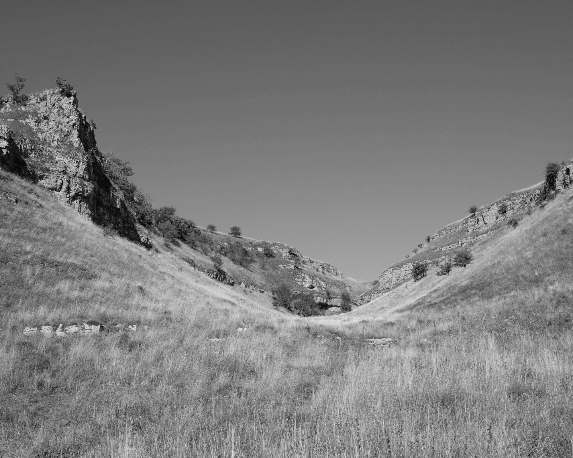 Black and white image of a 'U' shaped hill valley shot with Fujifilm GFX 50S