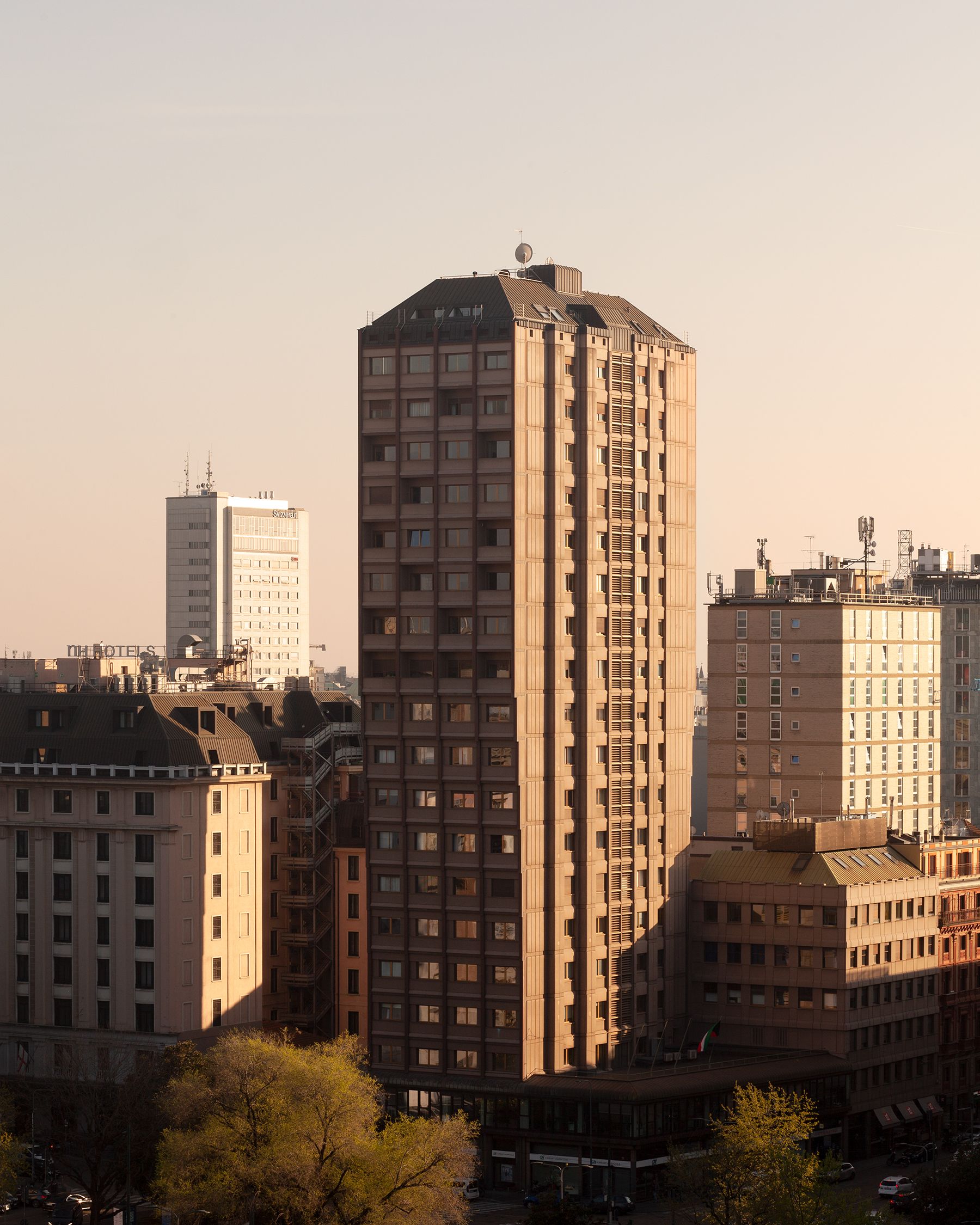 A tall building in the landscape in the evening