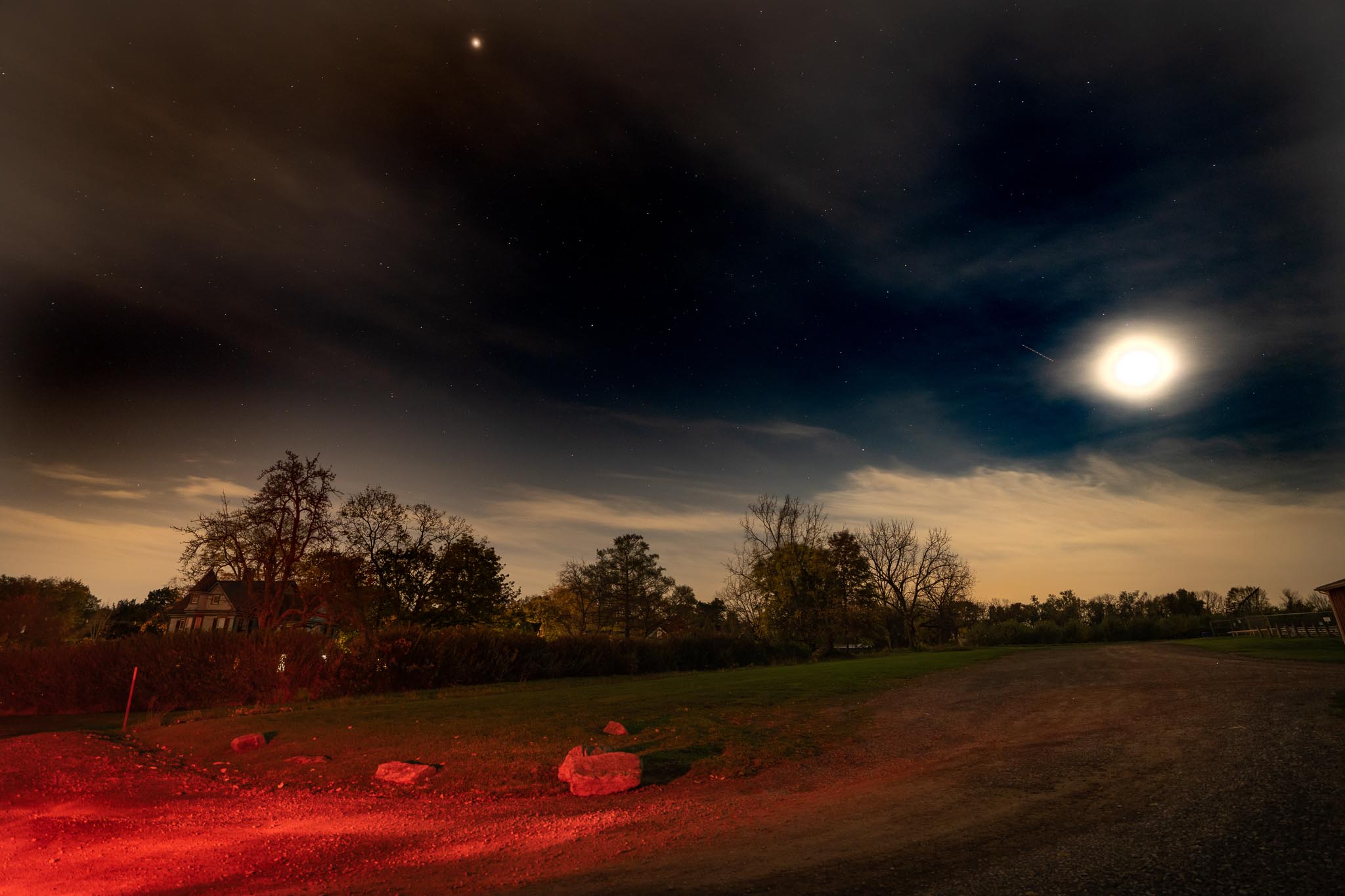 Long exposure of a field illuminated by red light. Shot with Sony A7R IV.