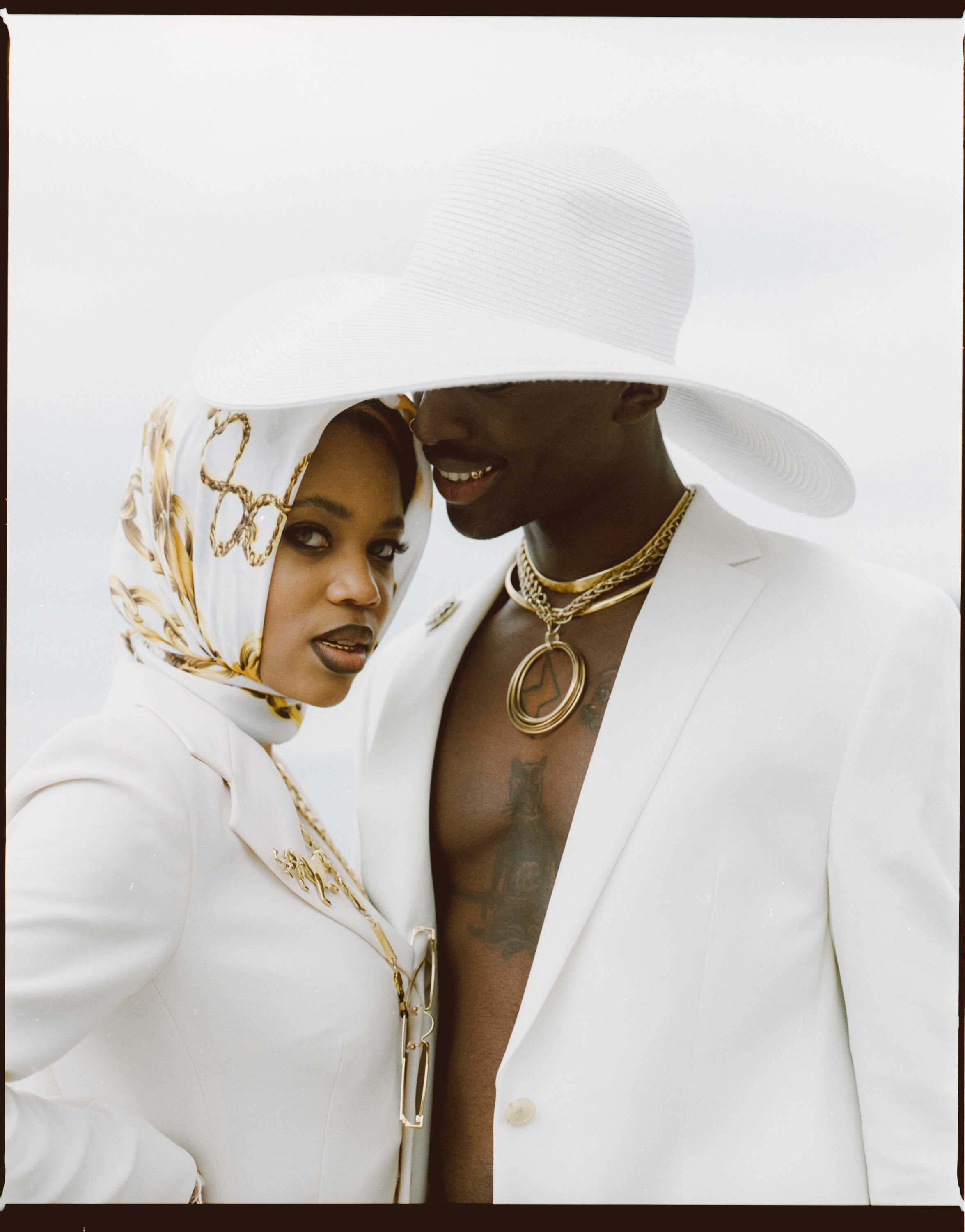 Portrait of man and women in white dress
