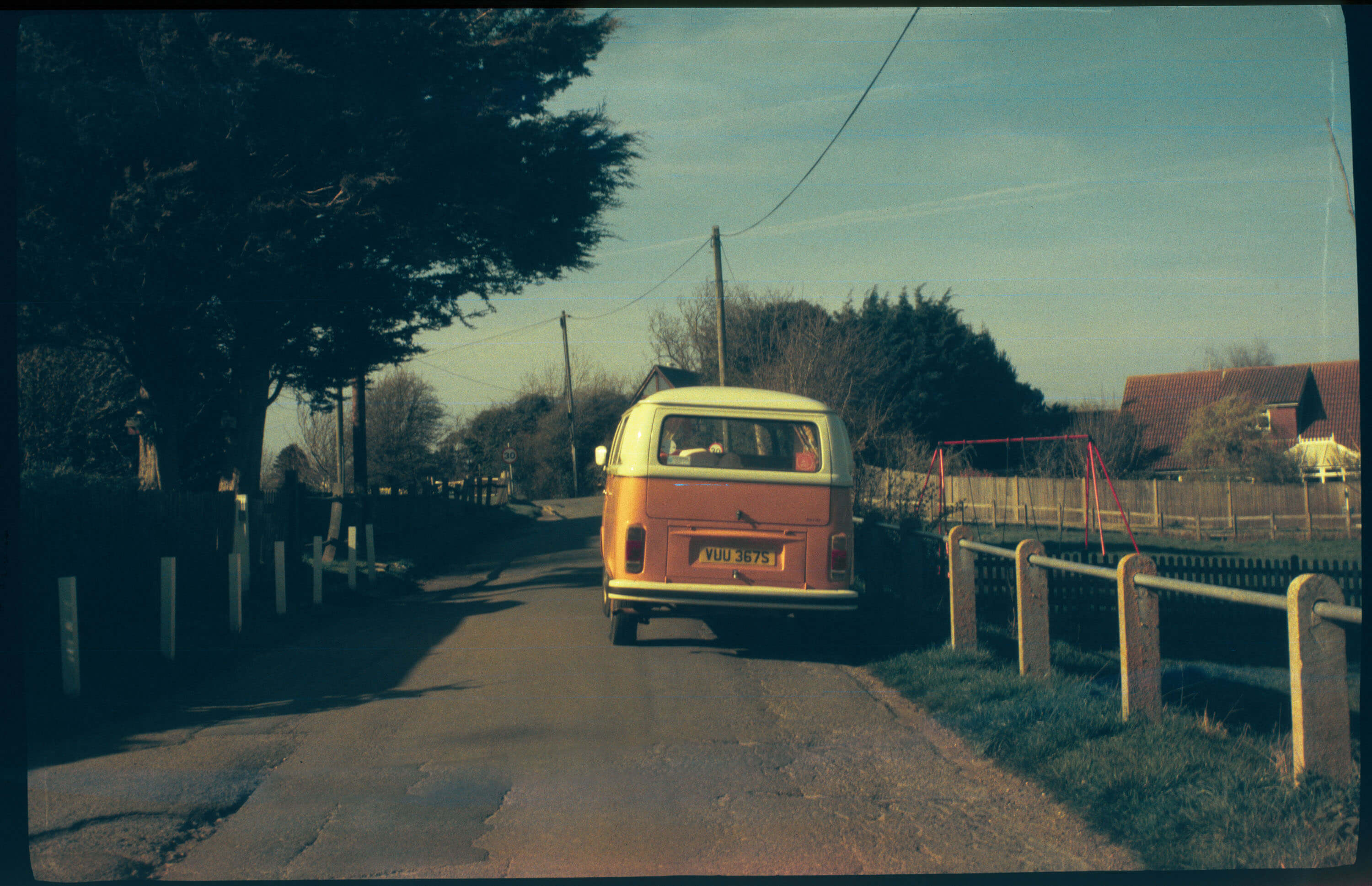 Orang VW Camper Van shot with a old lens taken on vintage film