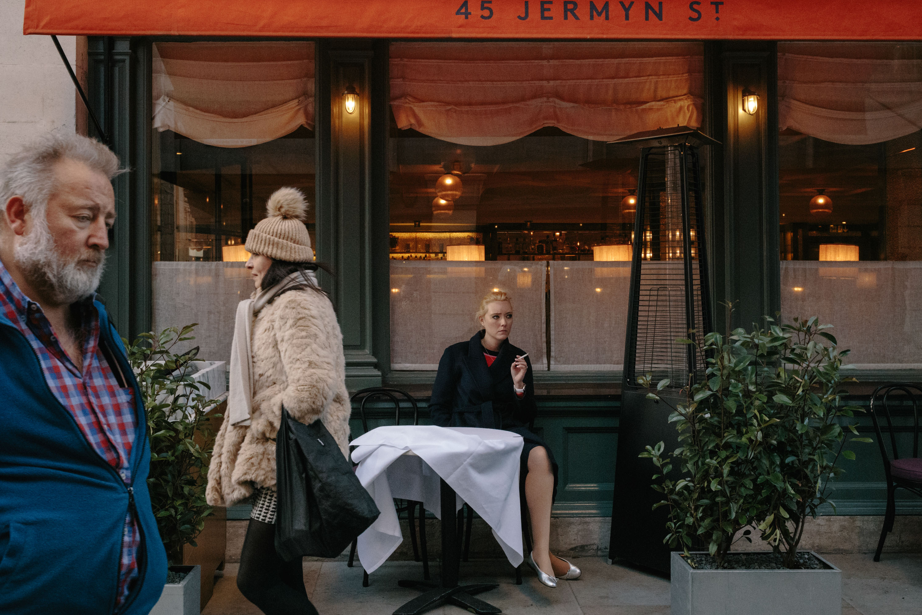 Woman smoking outside a cafe
