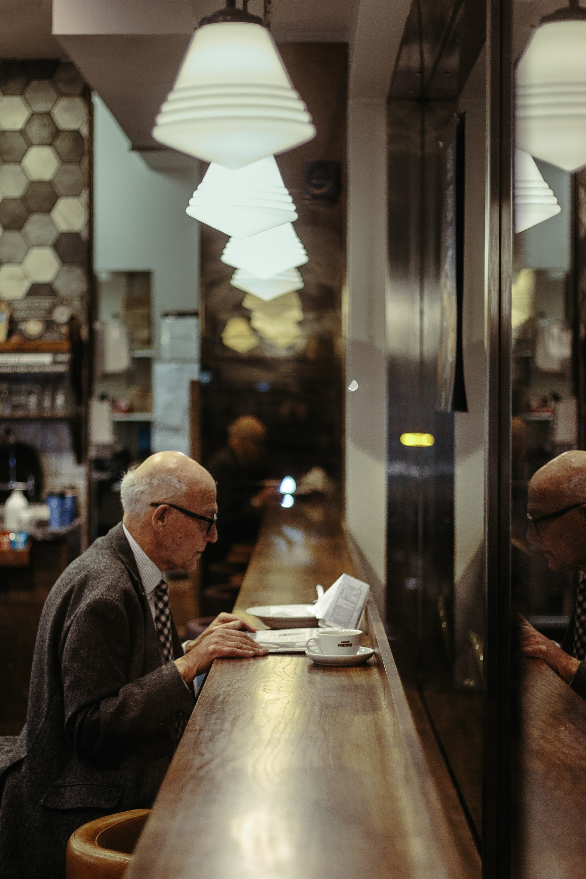 Older man sitting at a diner