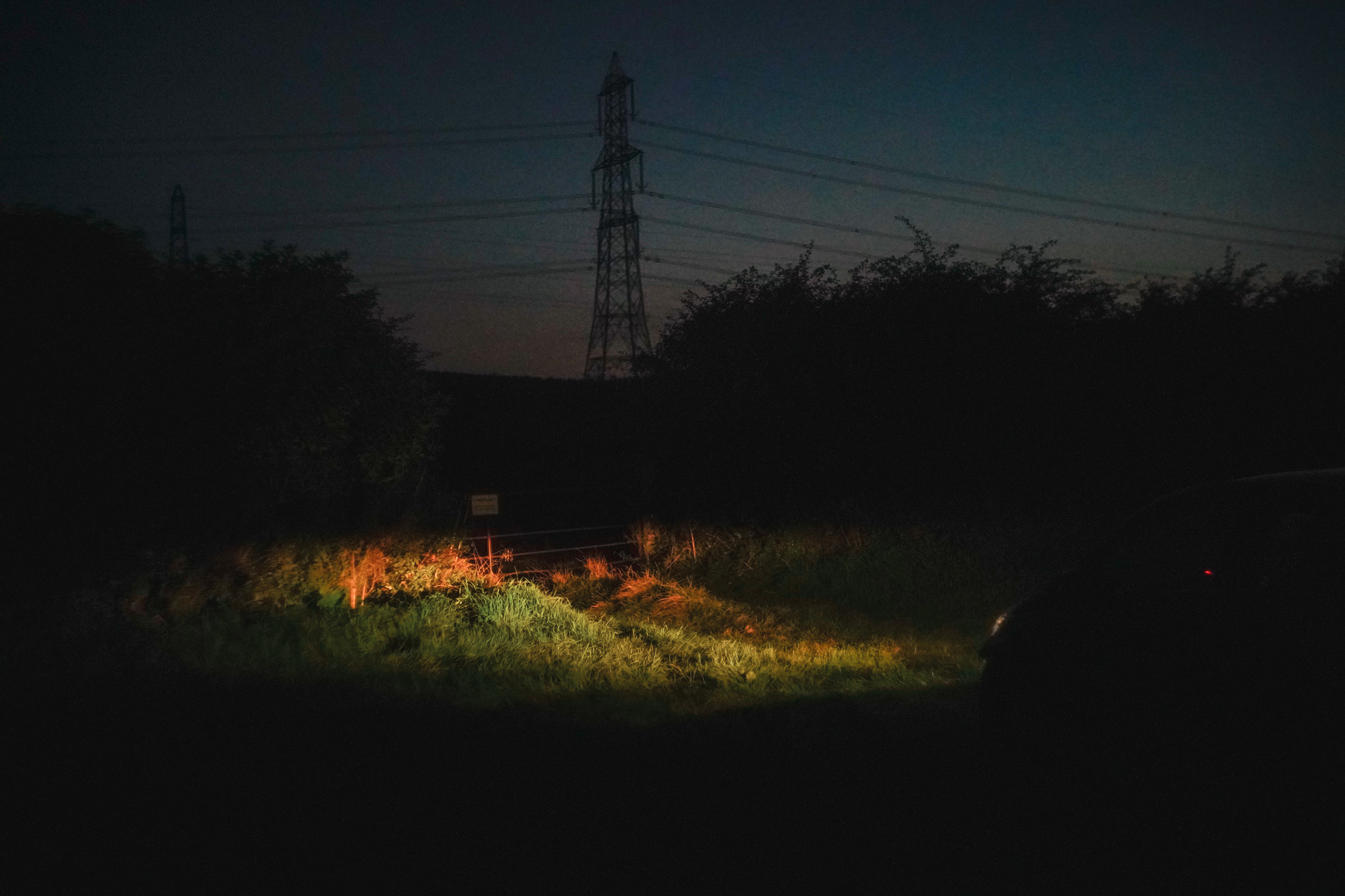 Night image of gate illuminated by car lights. Shot with the Helios 44-2 58mm f/2
