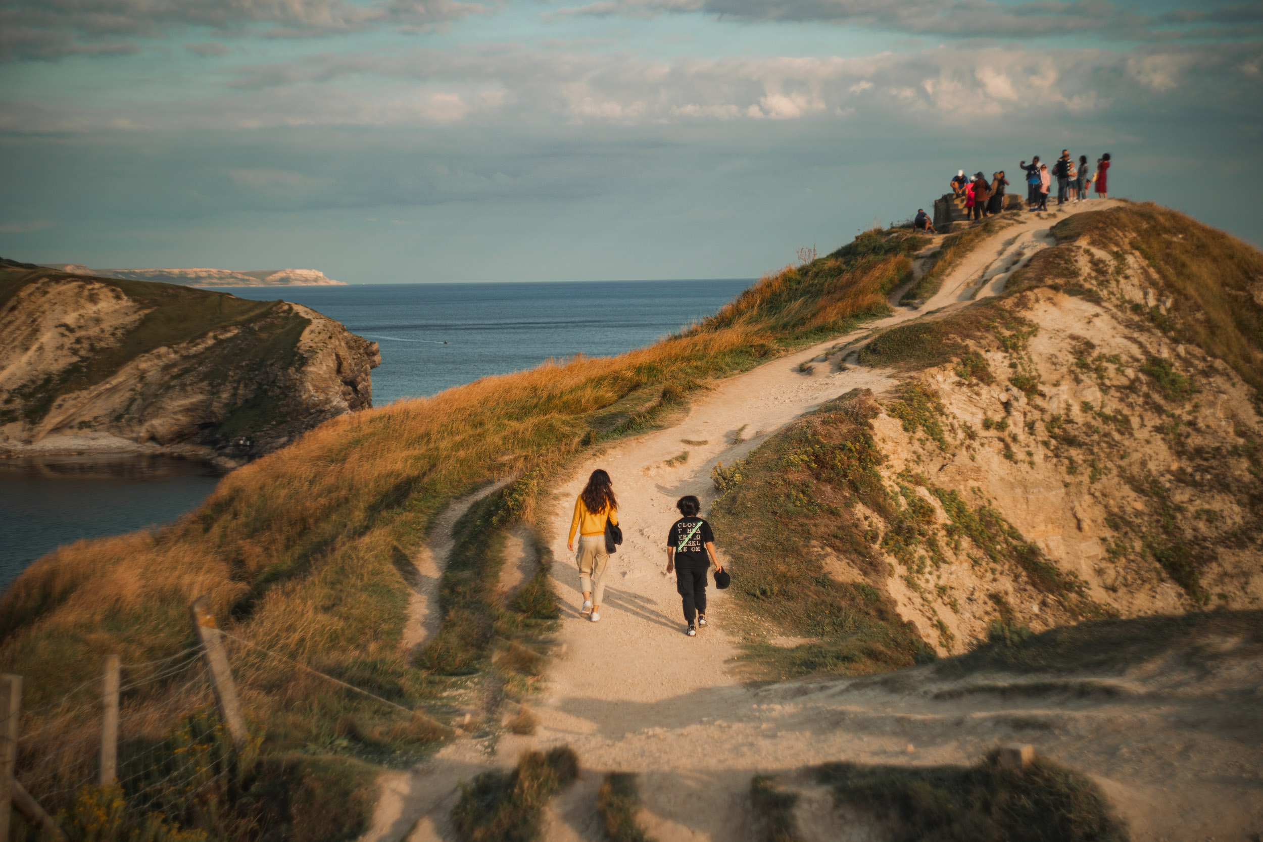 People walking up sandy rock cliff. Shot with the Helios 44-2 58mm f/2