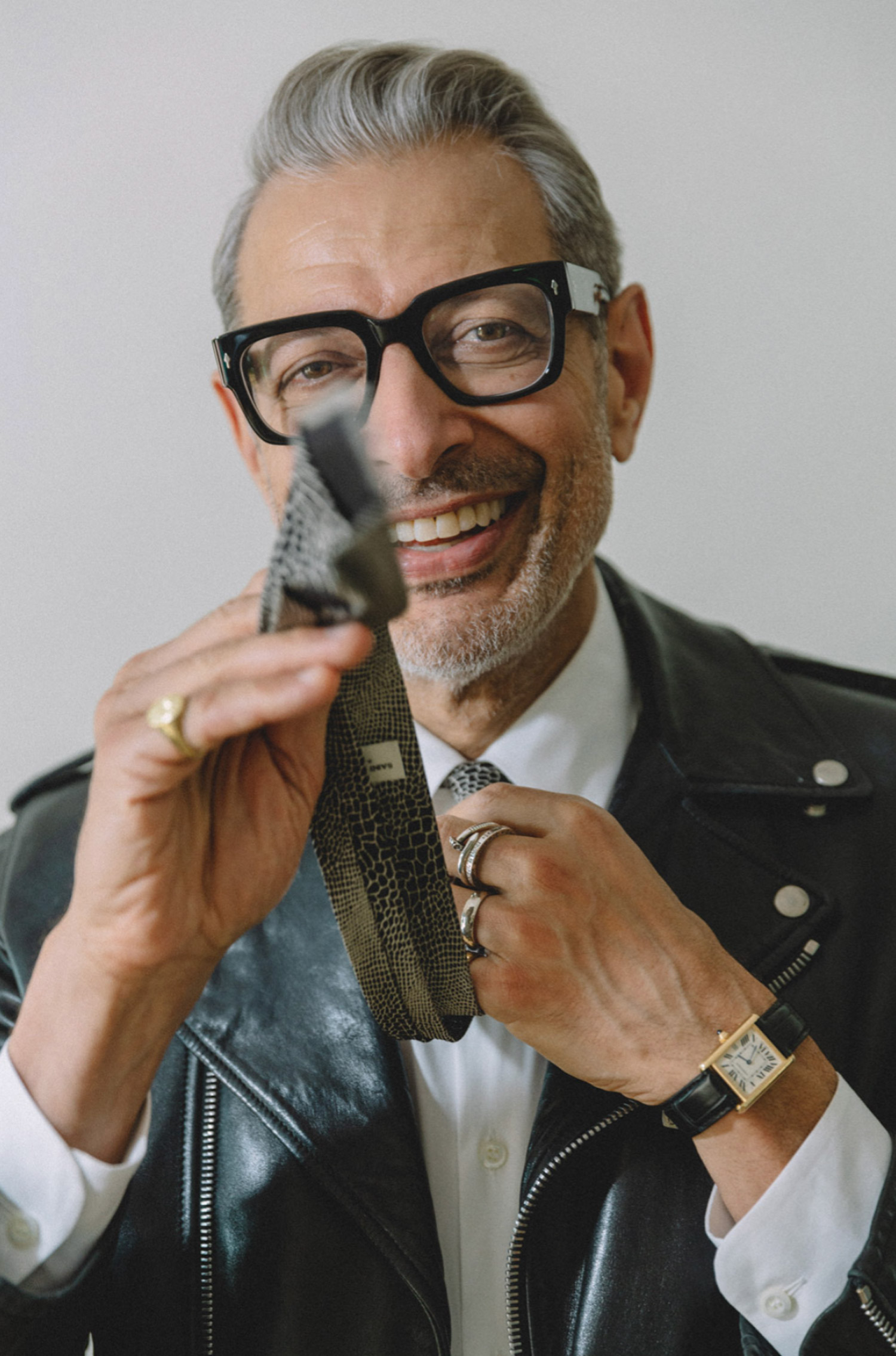 Portrait of Jeff Goldblum tying his tie 