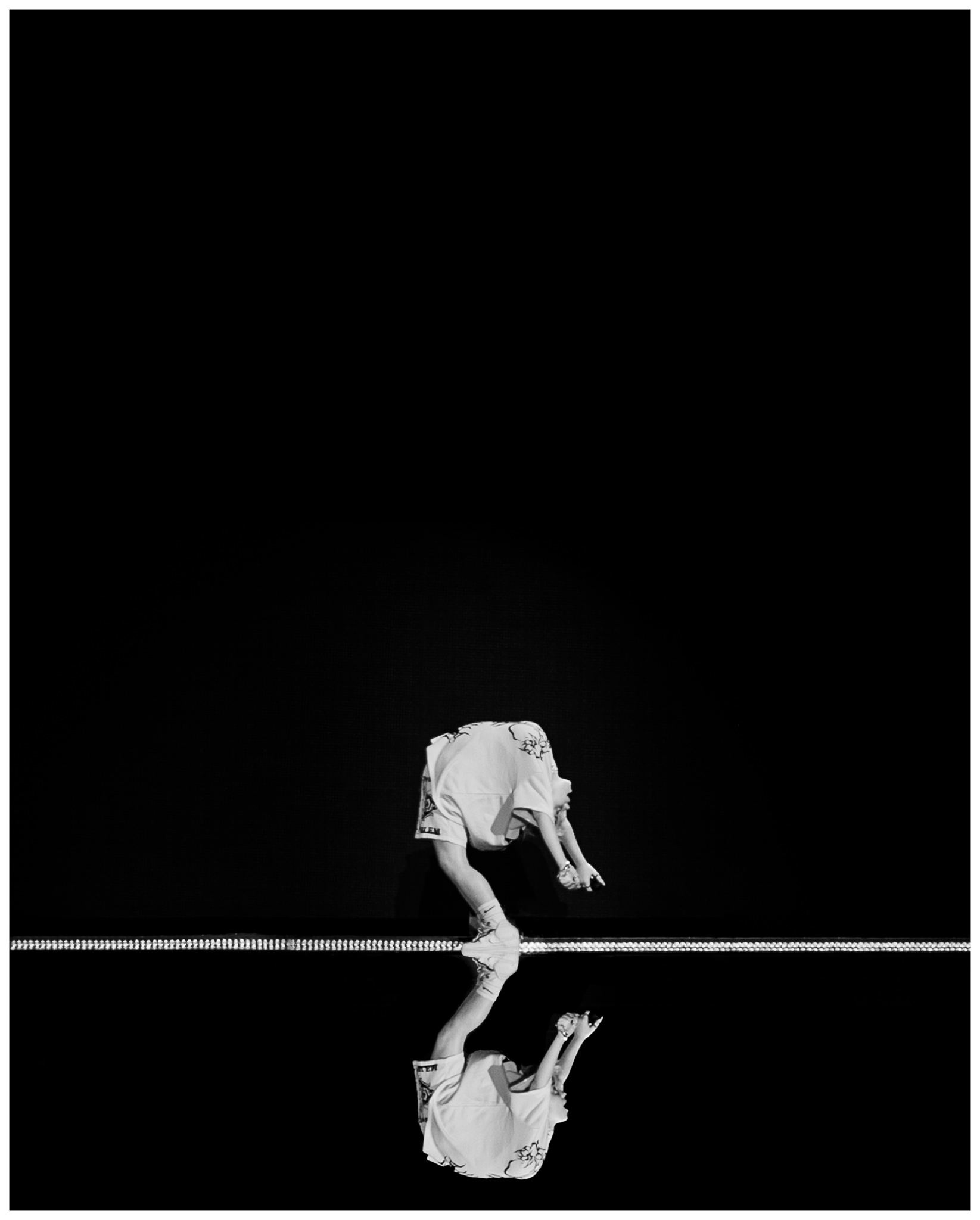 Billie Eilish performing live in black and white