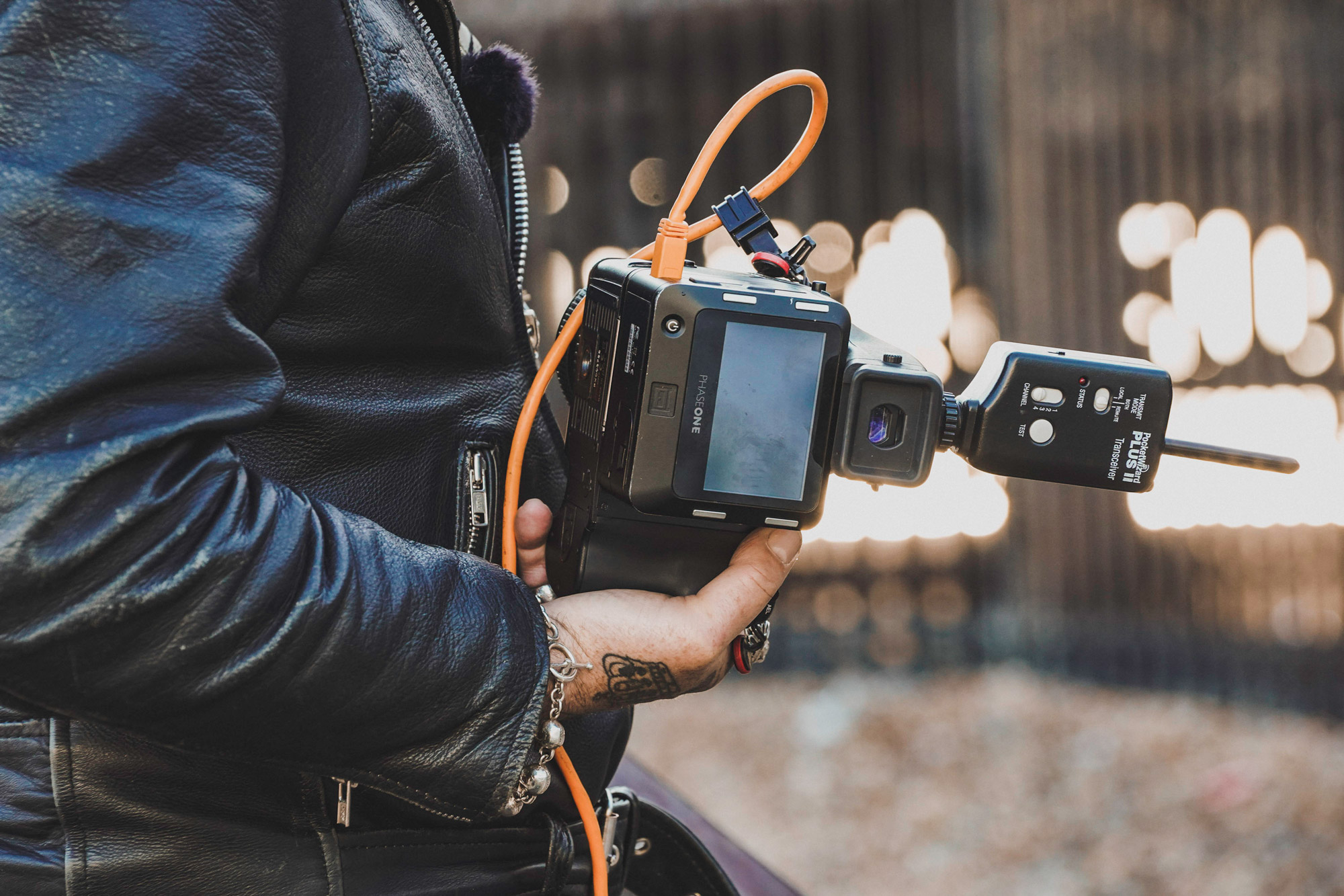 Behind-the-scenes photo of Ki Price holding the Phase One 645DF+, Phase One IQ150 and Schneider Kreuznach LS 80mm f/2.8