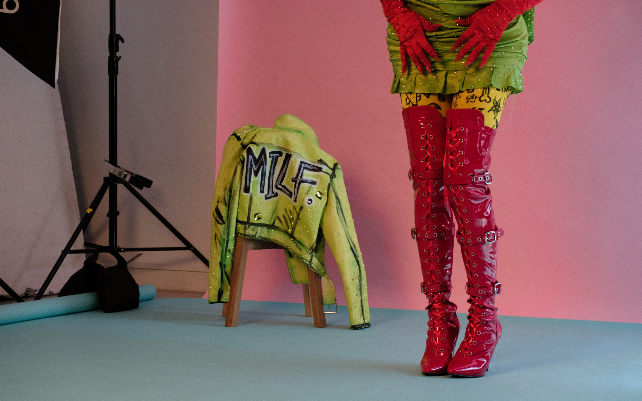 photoshoot of a models legs wearing red boots