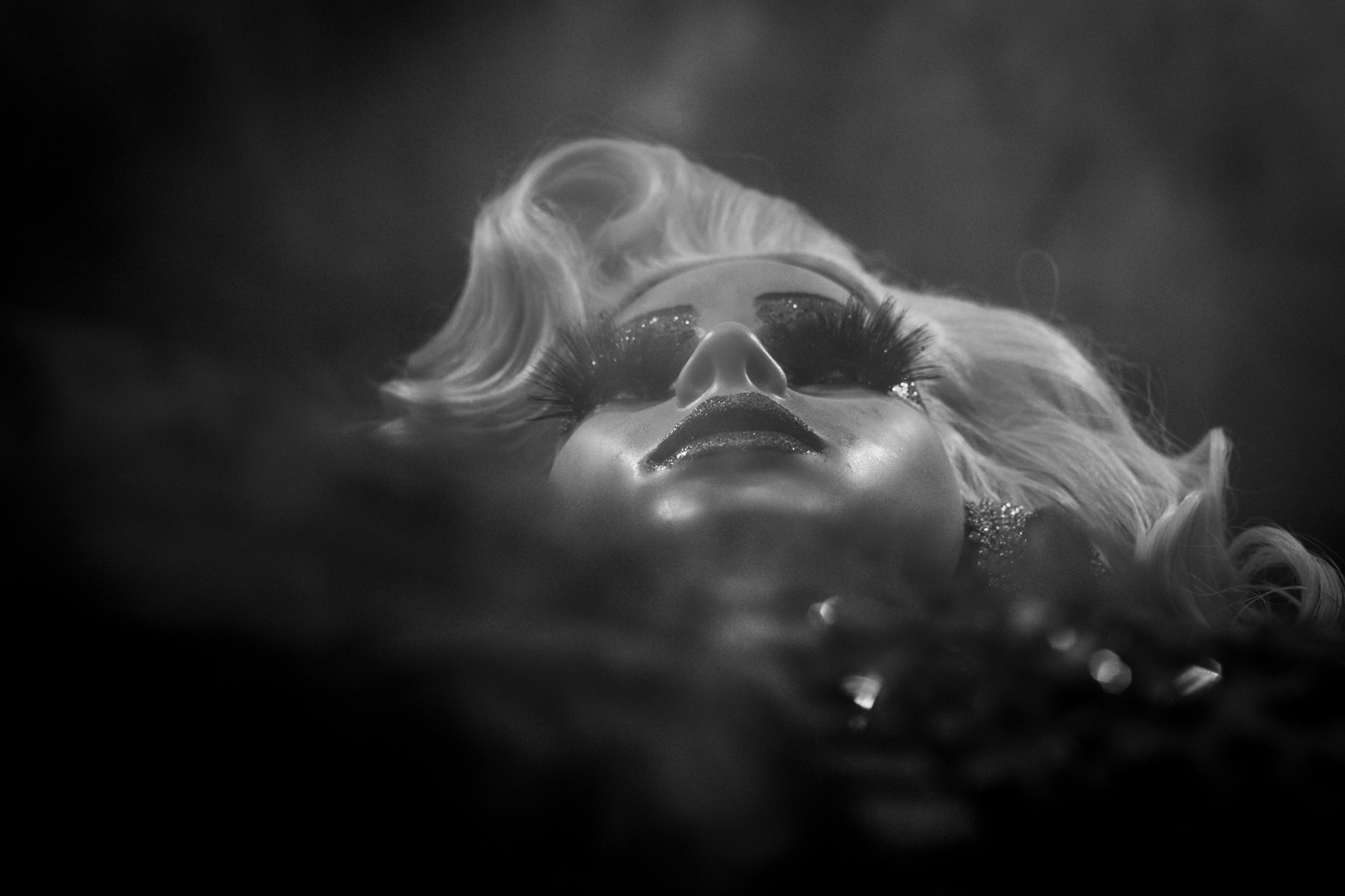Very low angle shot of a manikin doll at night