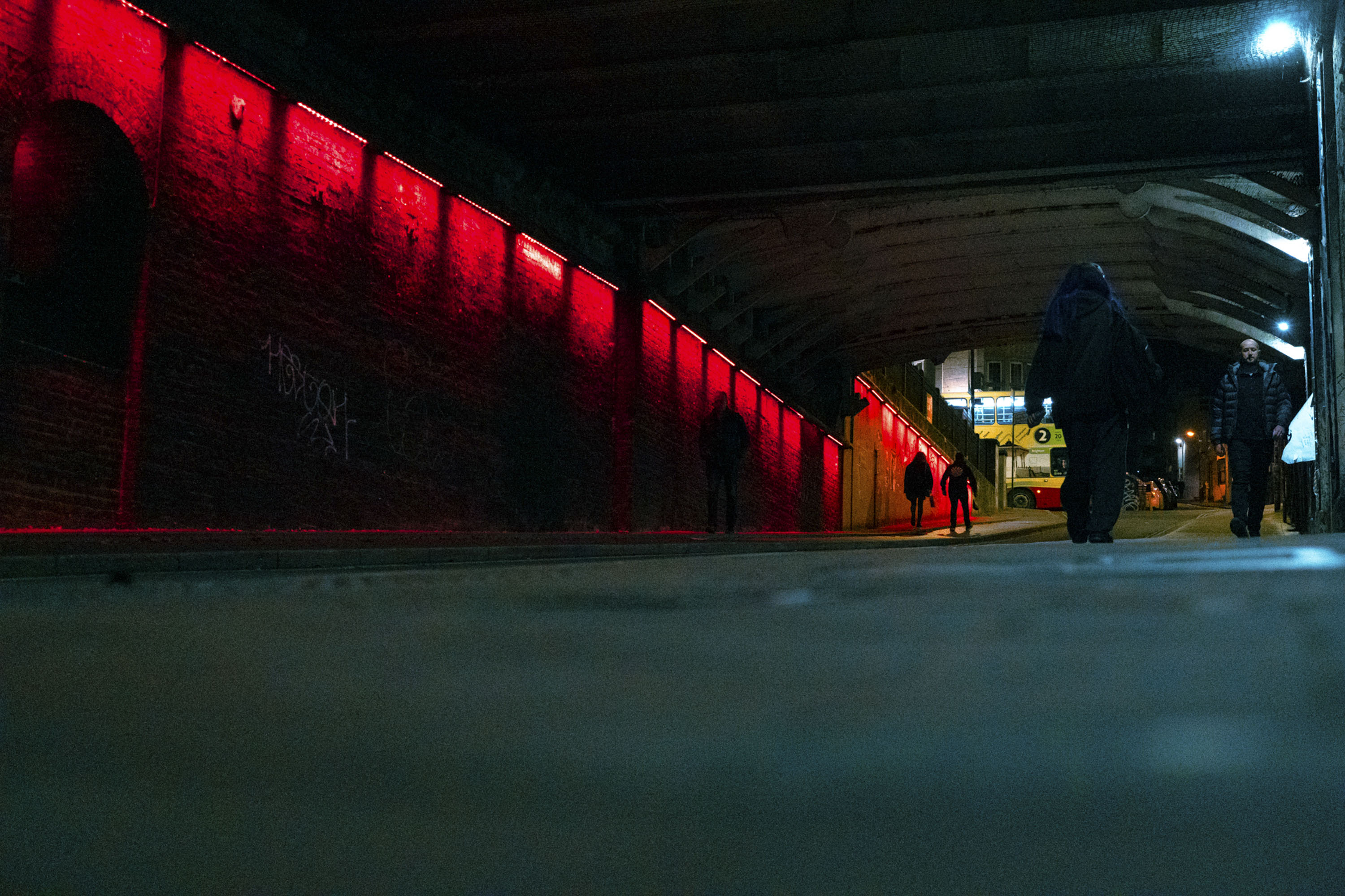 Low angle street landscape at night under Brighton station 