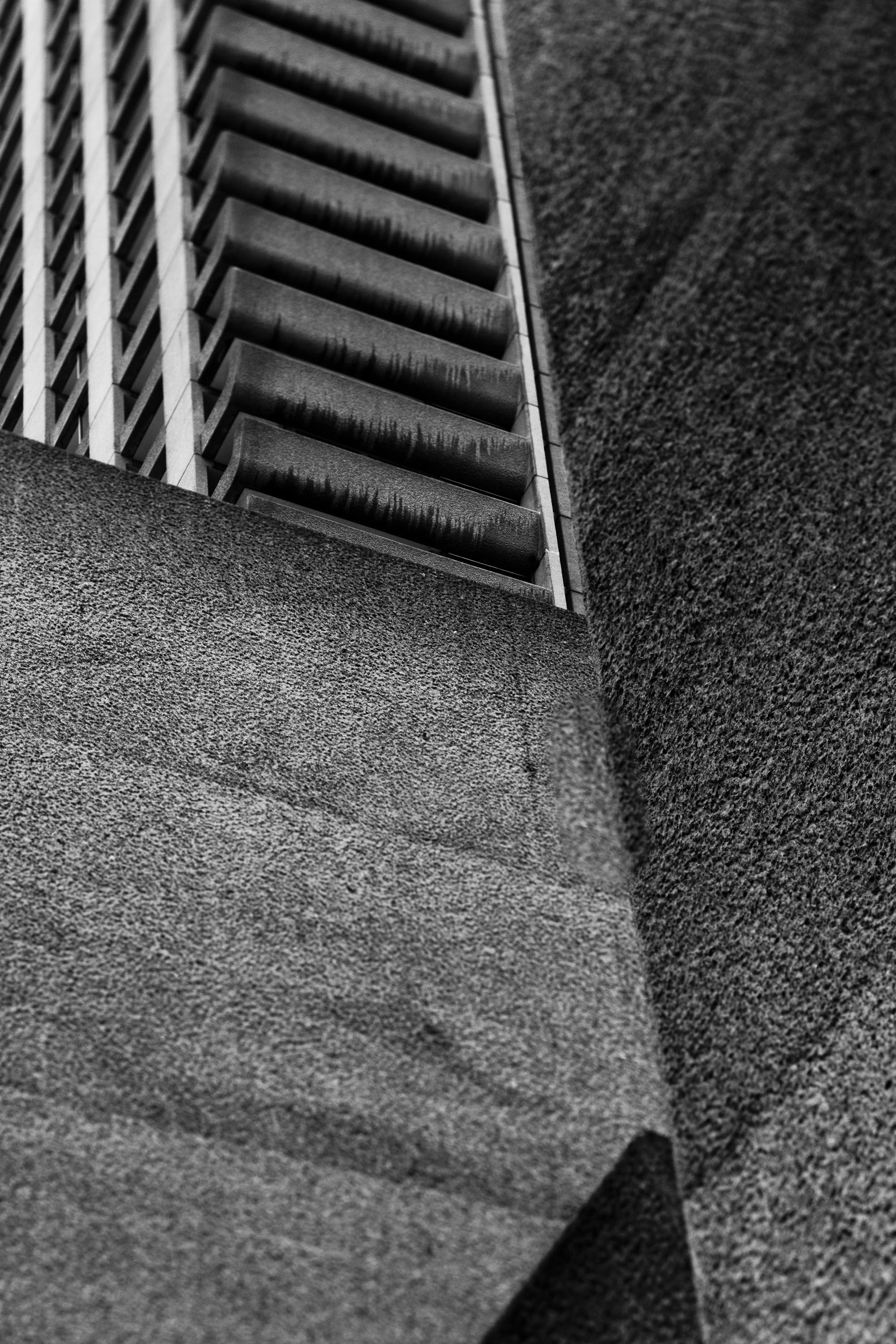 a black & white photo of a side of a building 3