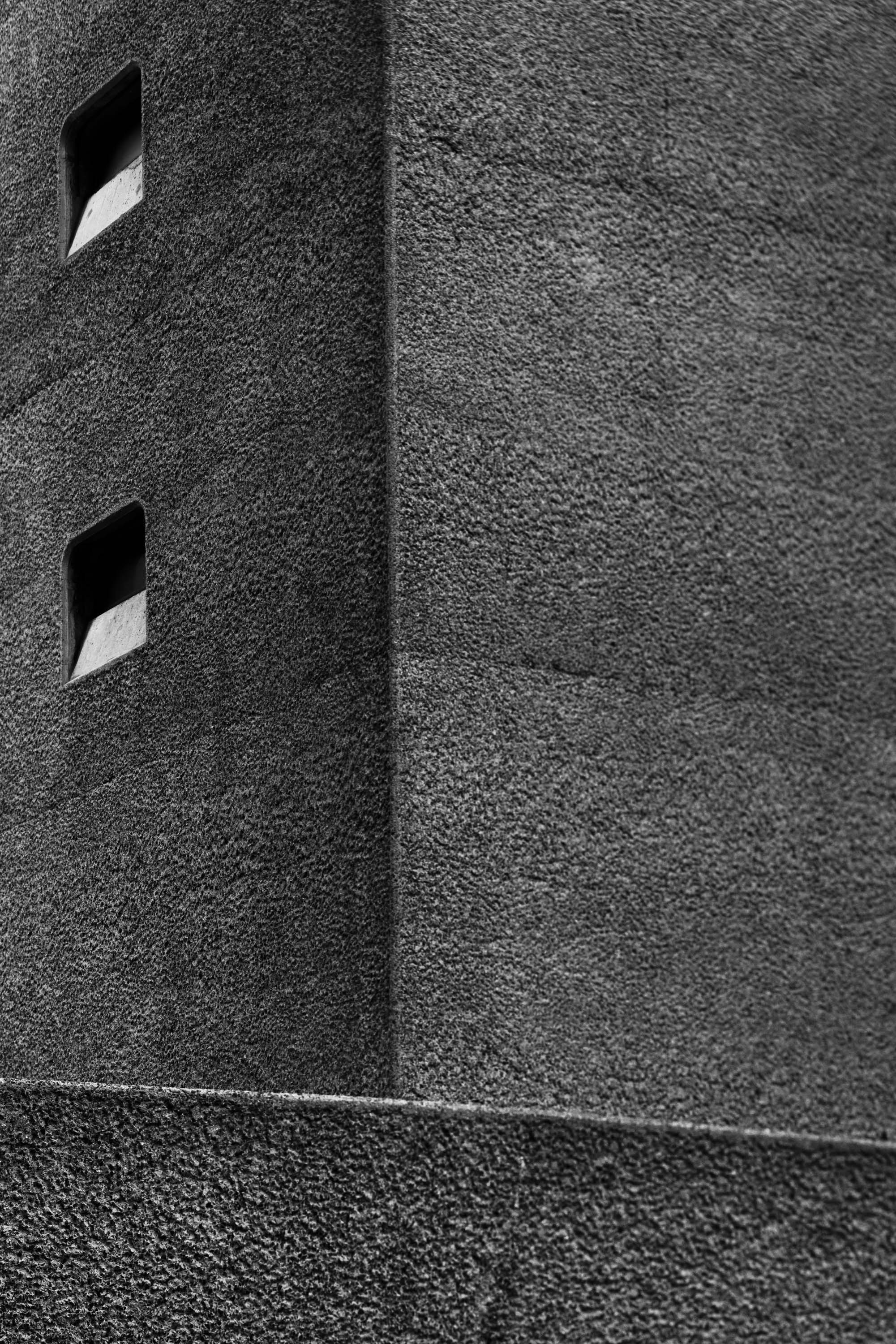a black & white photo of a side of a building