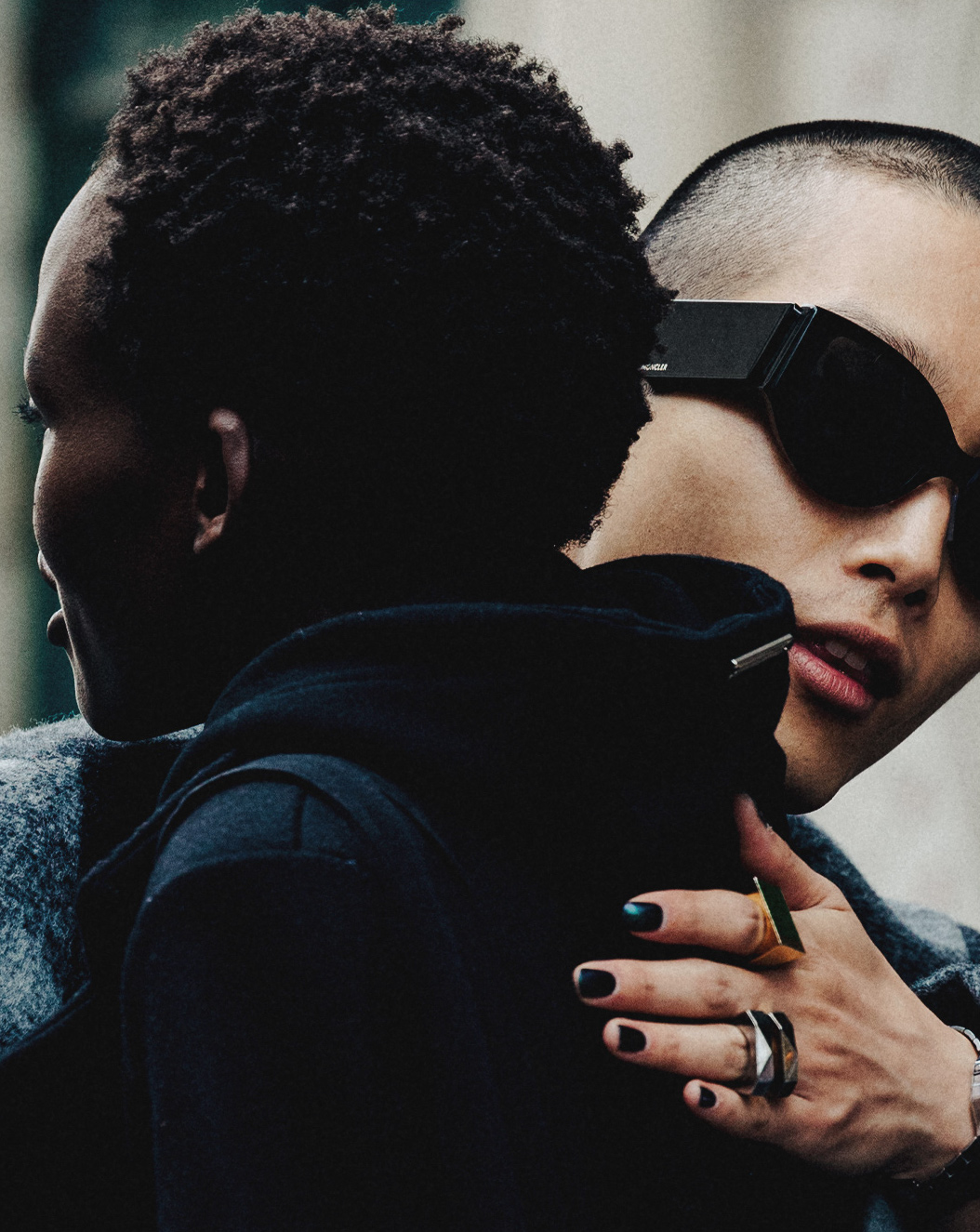 Two people hugging close up