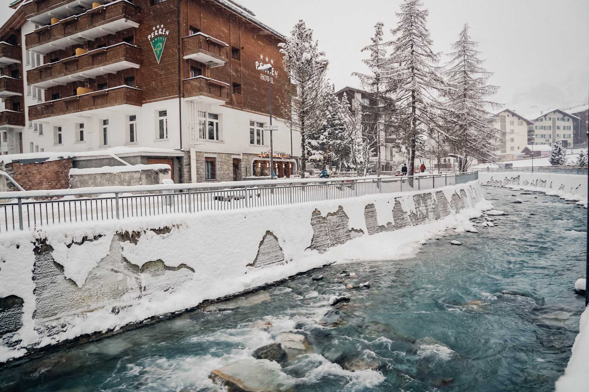 Icy river runs through the village of Zermatt, Switzerland