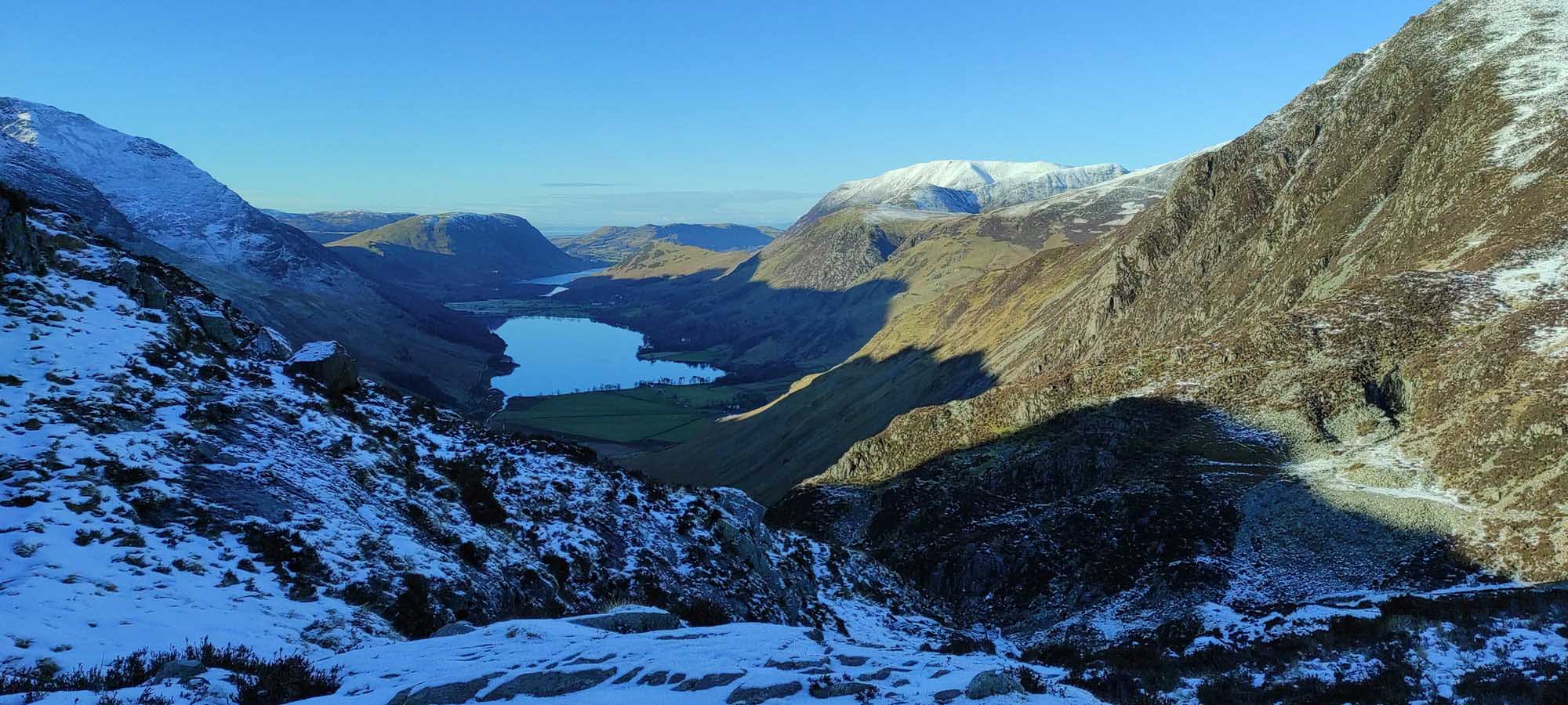 Landscape shot of two mountains with snow in the shadows. 