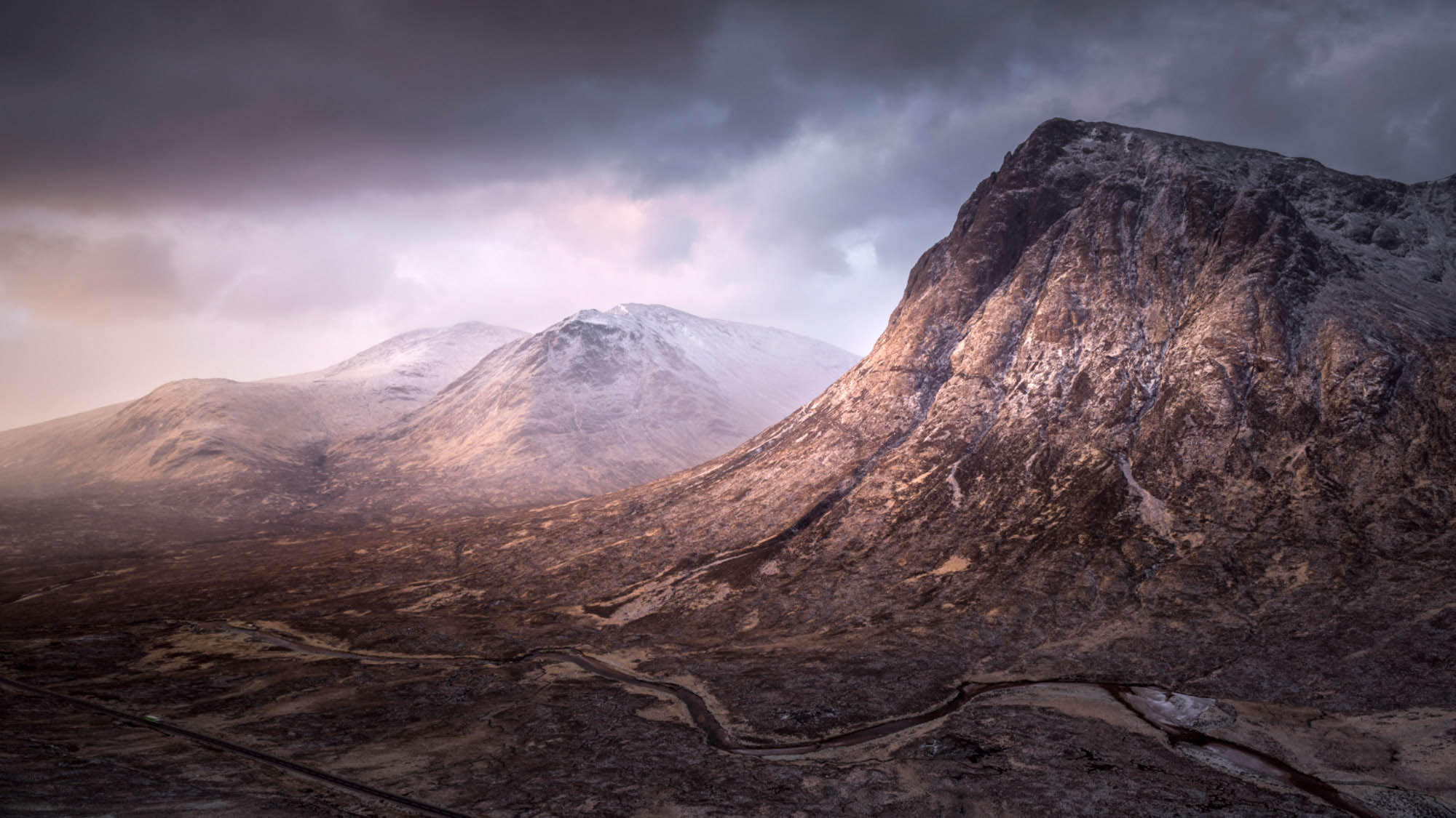 The Stob Dearg & the White Corries with clouds rolling over the mountains in the background.