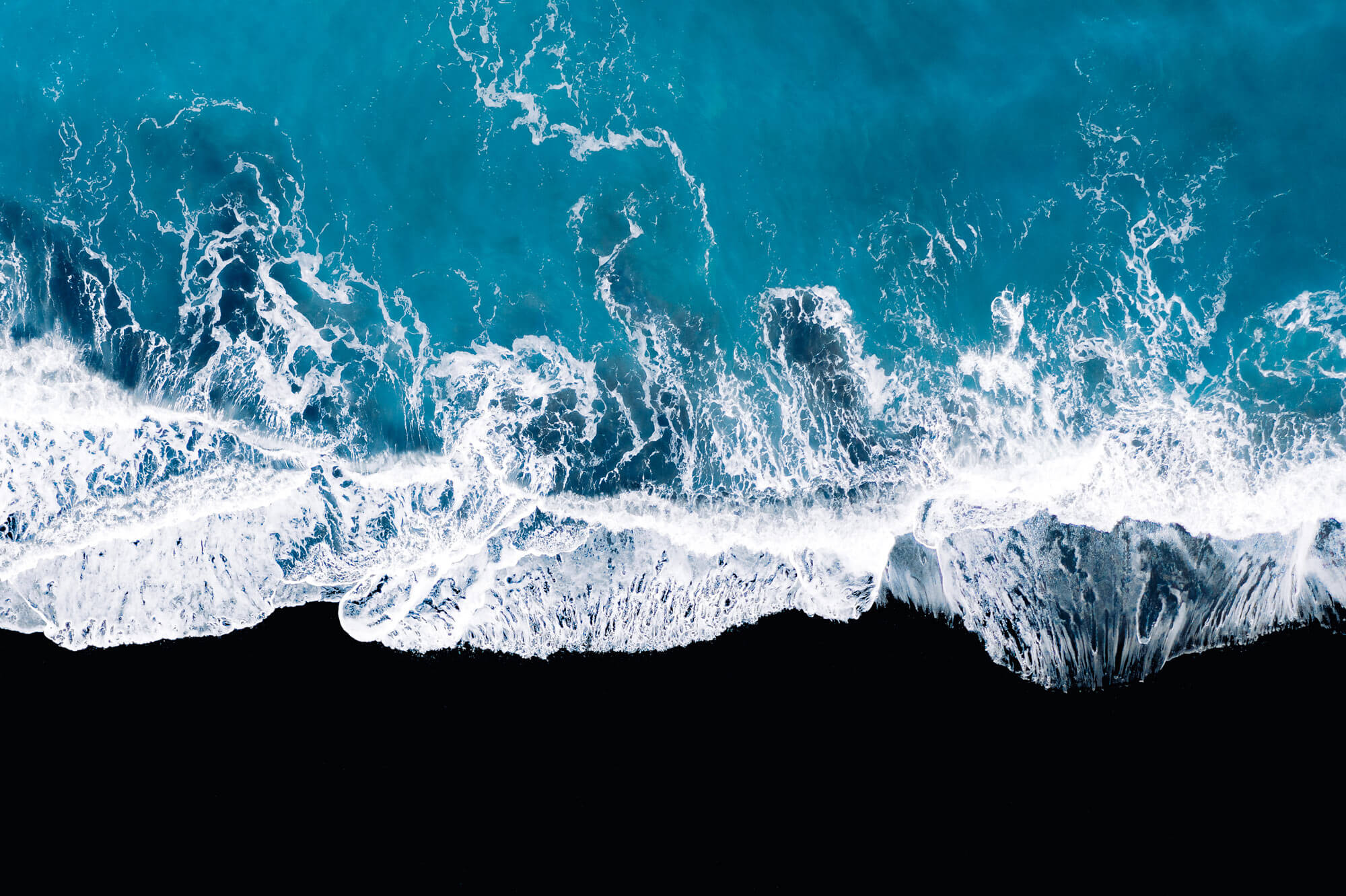 The ocean from above with a wave