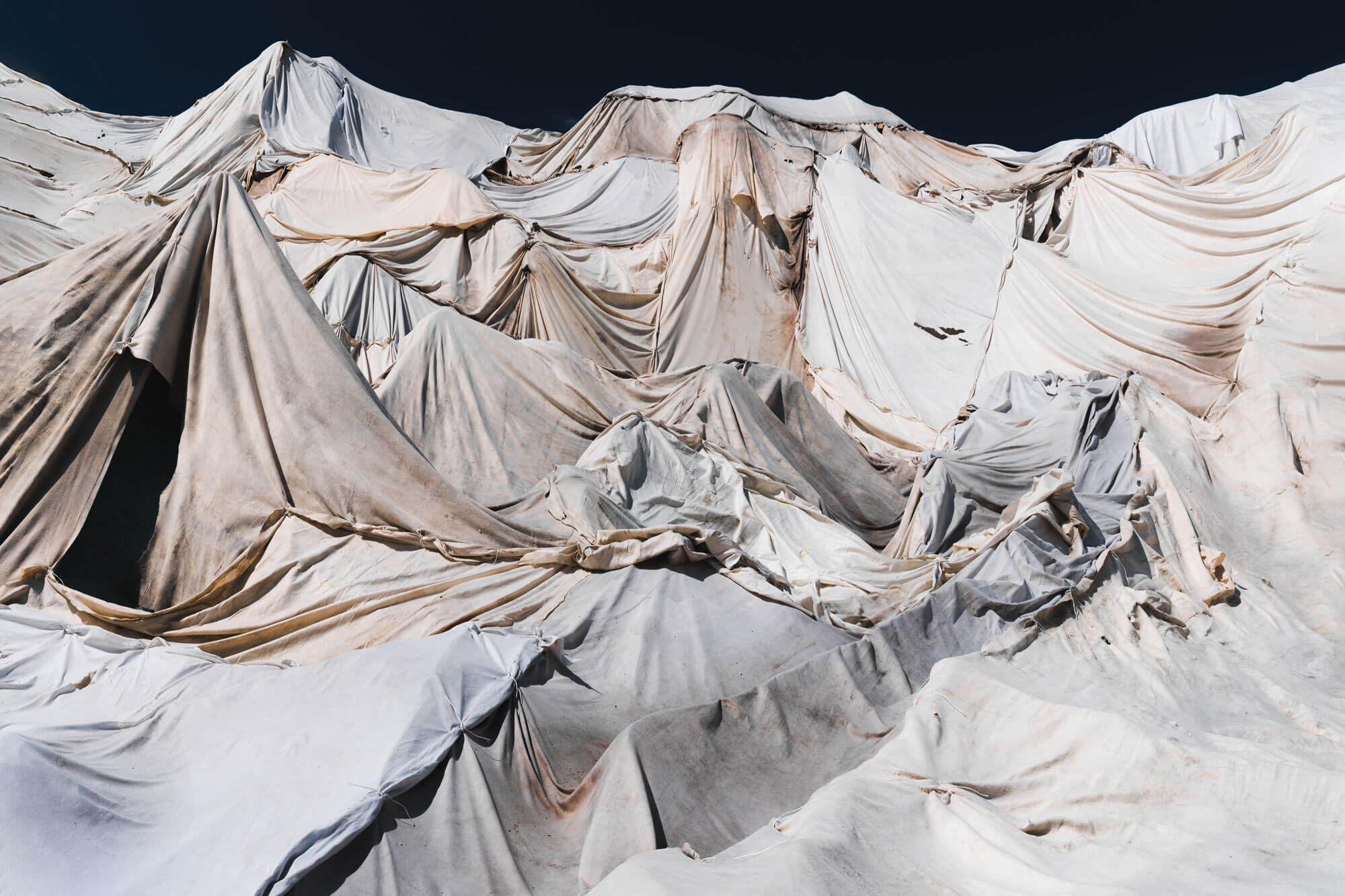 Off-white fabric layered to resemble a snowy mountain range