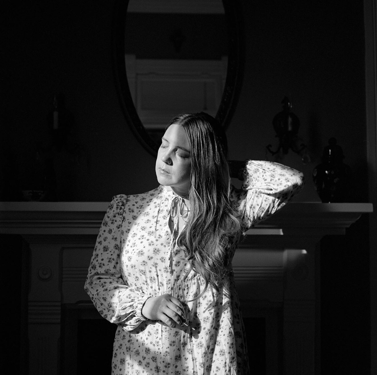 A woman in window light.
