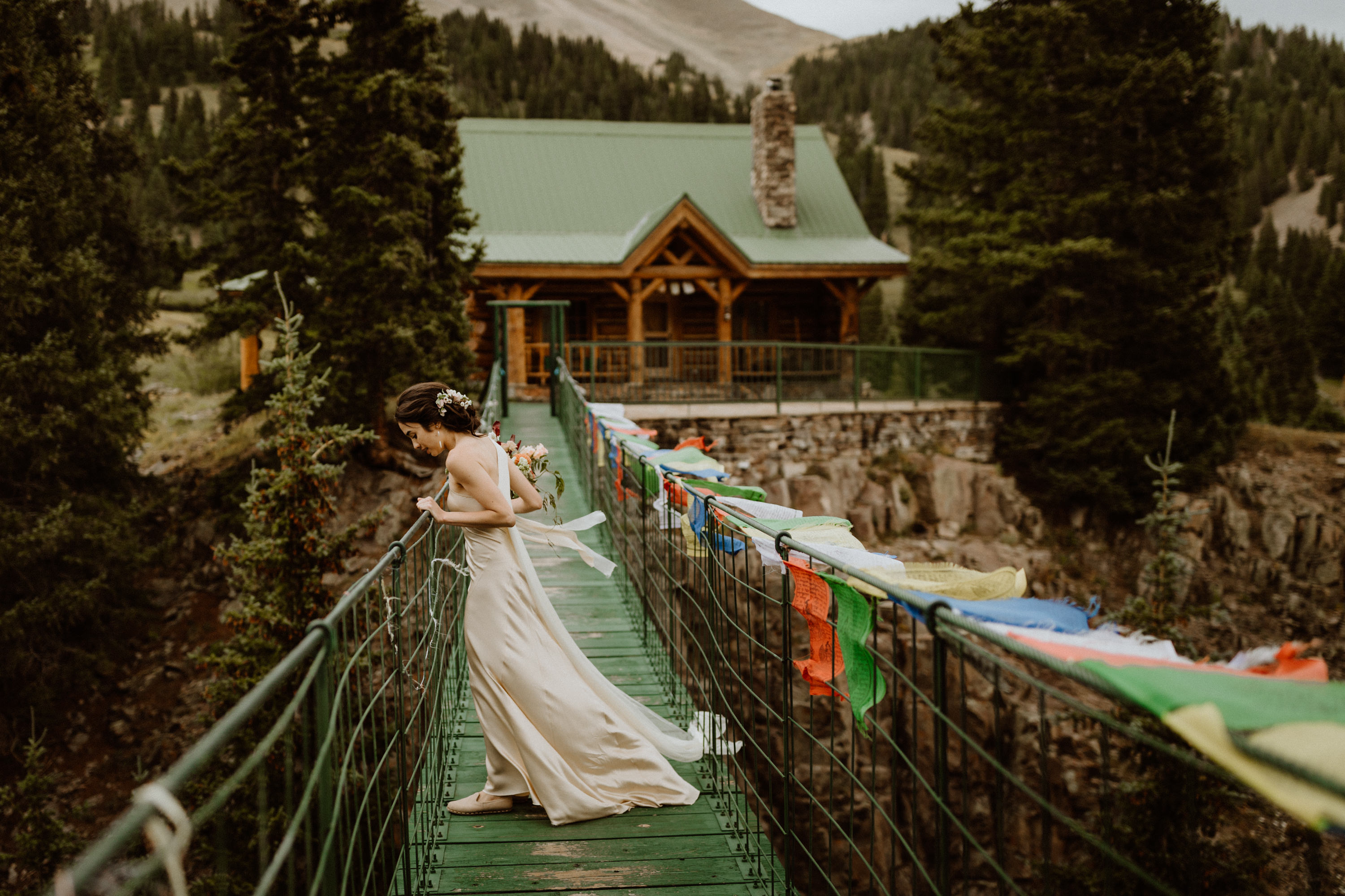 A bride on a bridge by Cedar & Pines