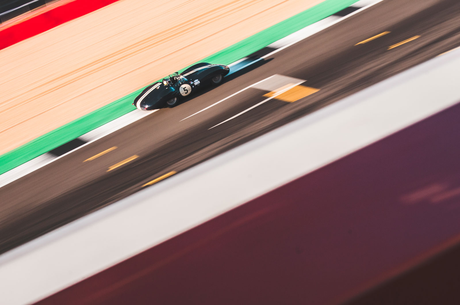 Photo of a car racing at Silverstone racecourse.