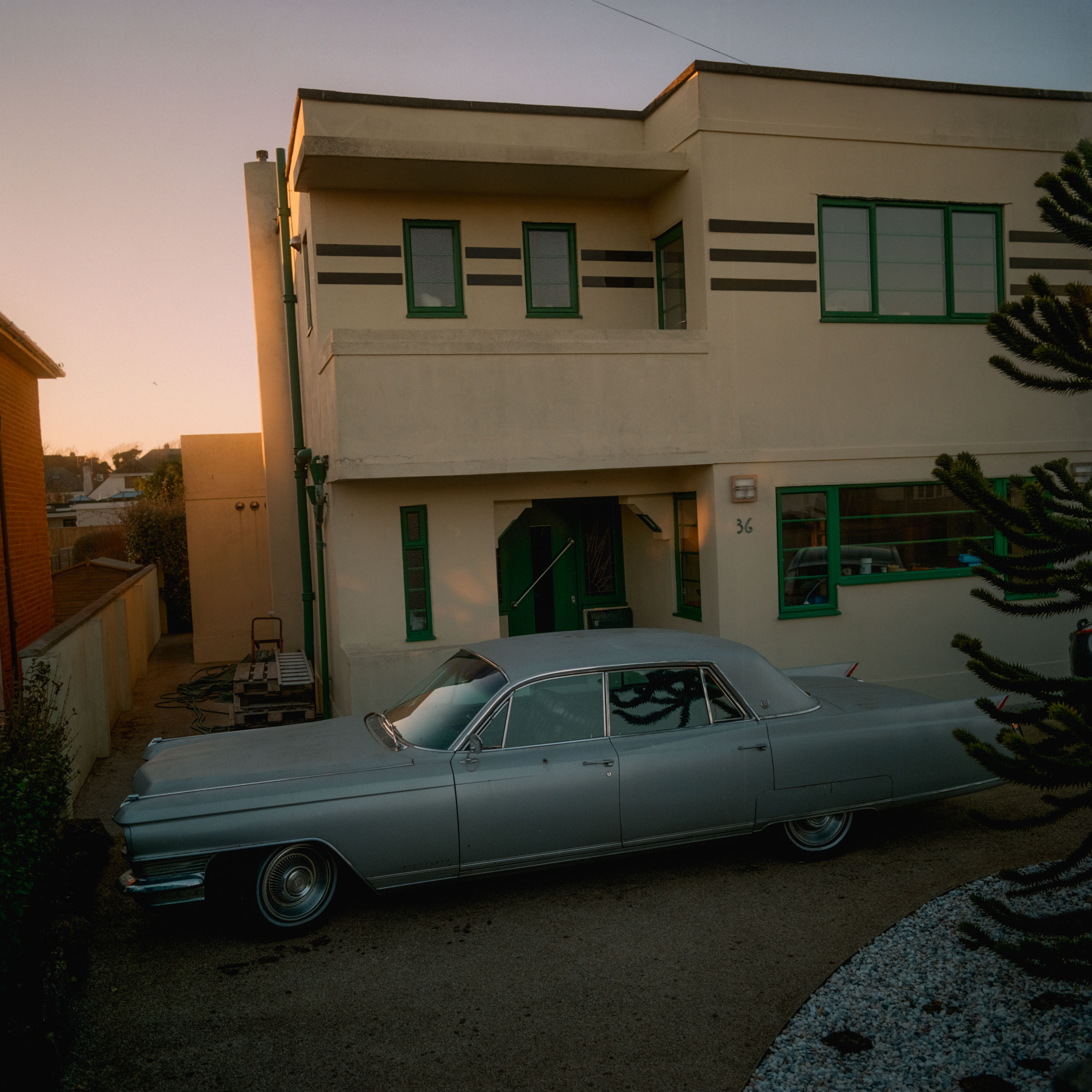 An art deco house and vintage car shot on Kodak Gold 200 120mm medium format film