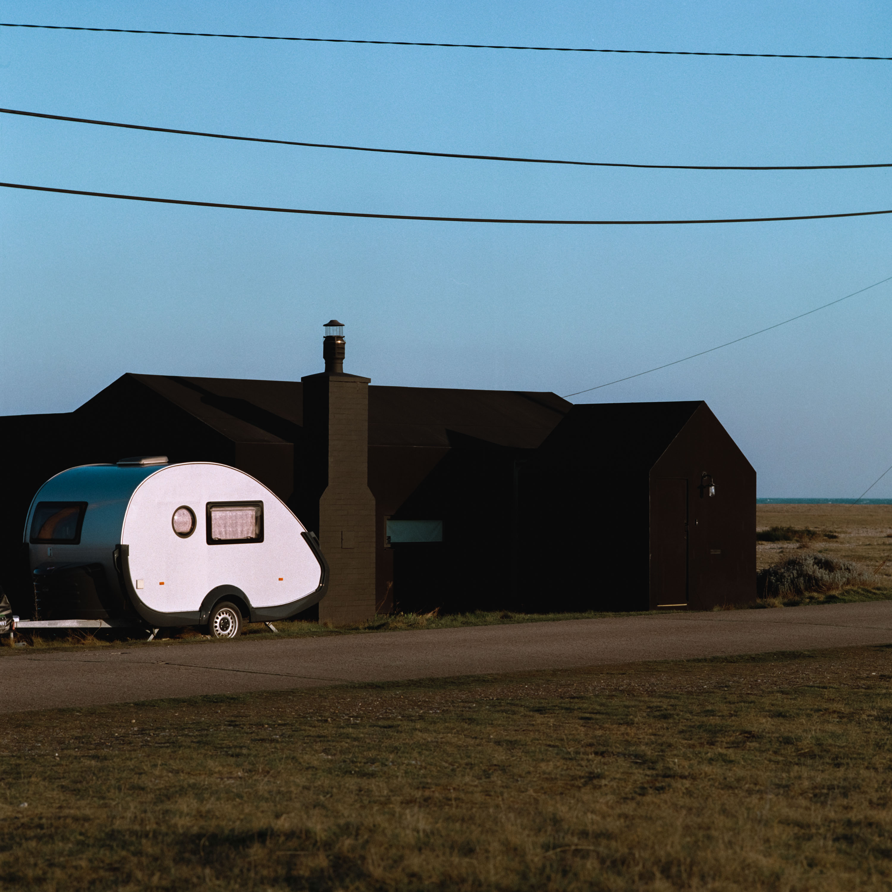 A caravan next to a house shot on Kodak Gold 200 120mm medium format film