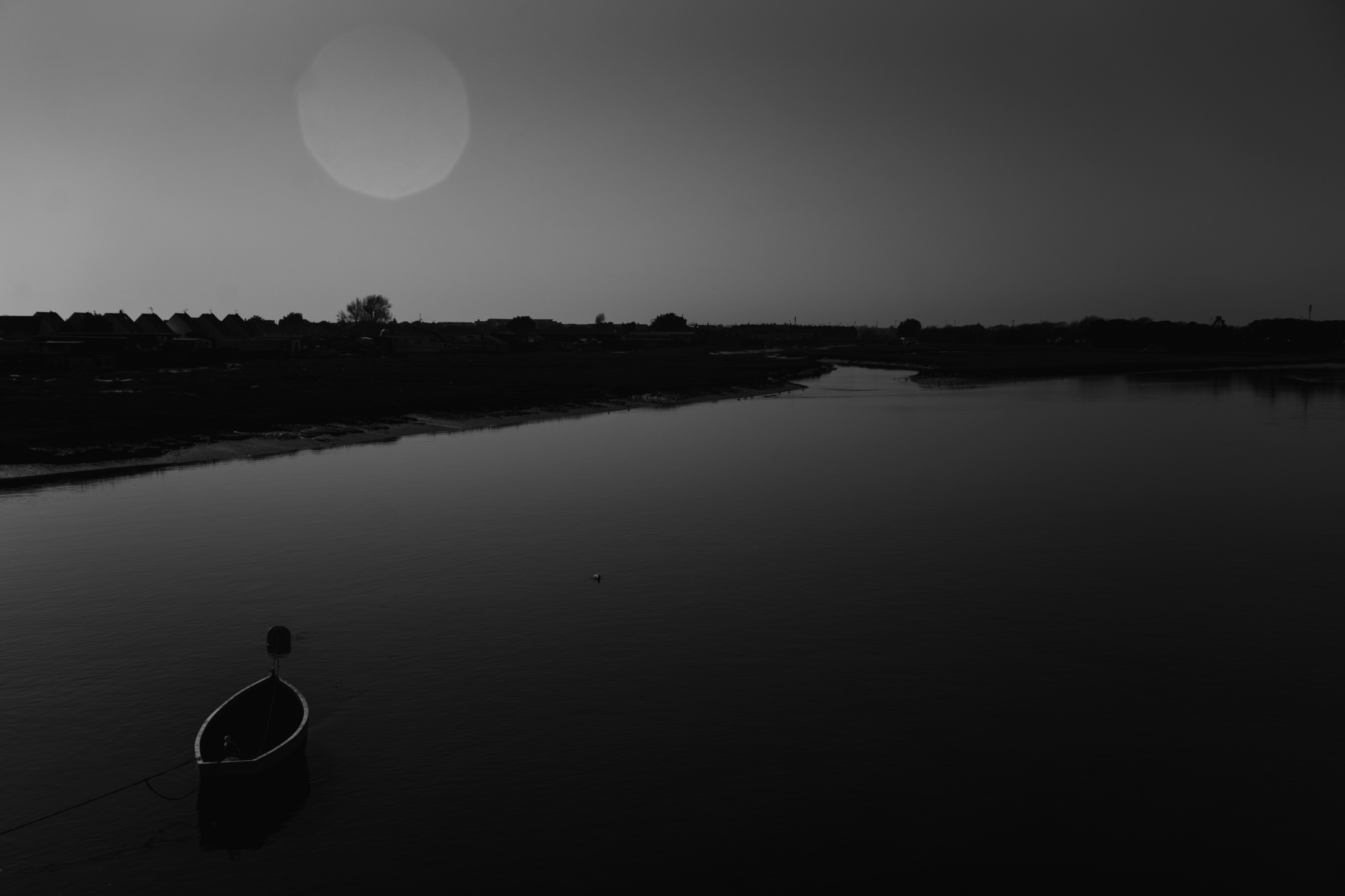 a black and white photo showing the effects of lens flare