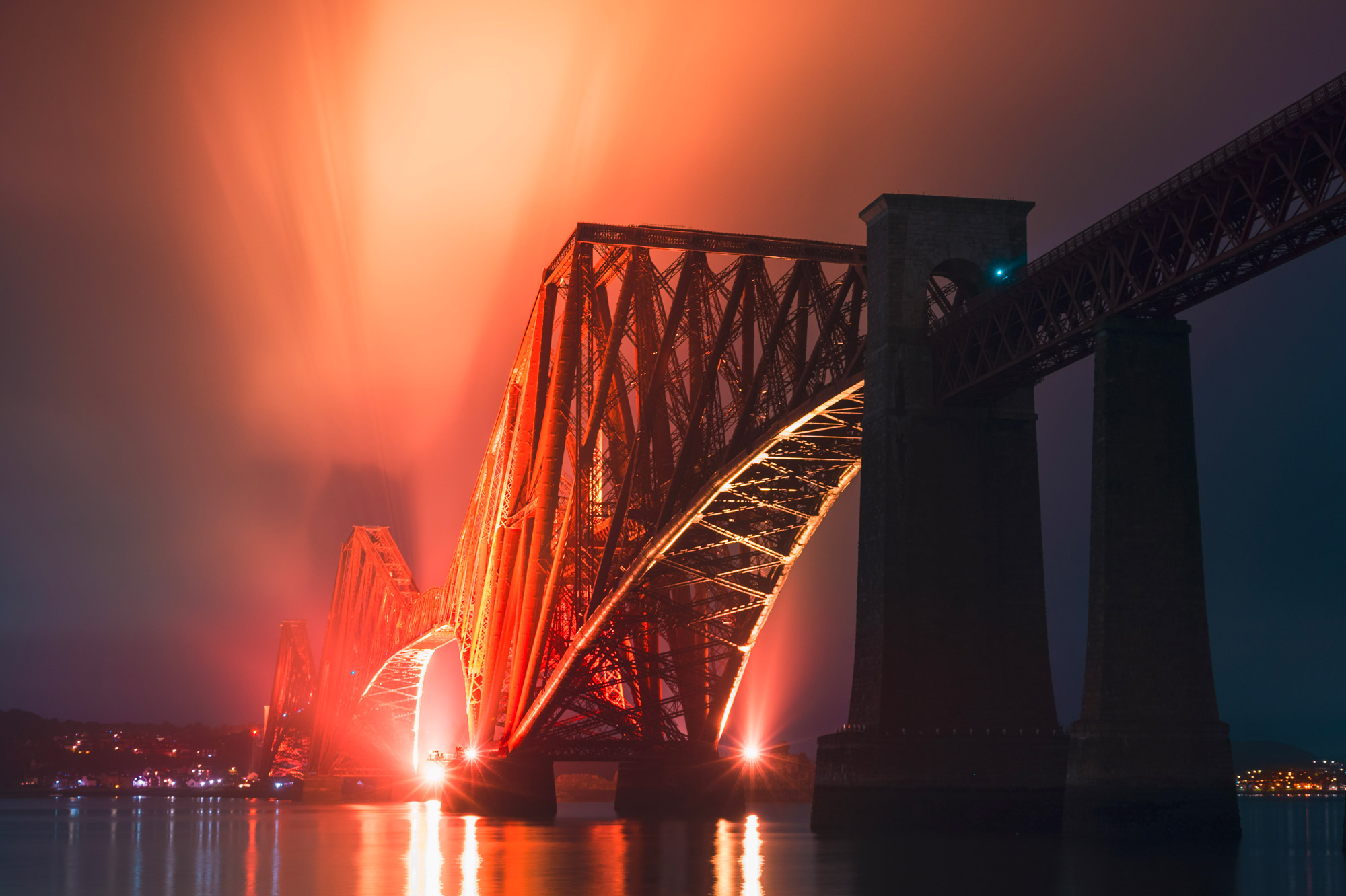 A bridge shot at night with bright orange lights illuminating the sky, shot with Nikon Z7