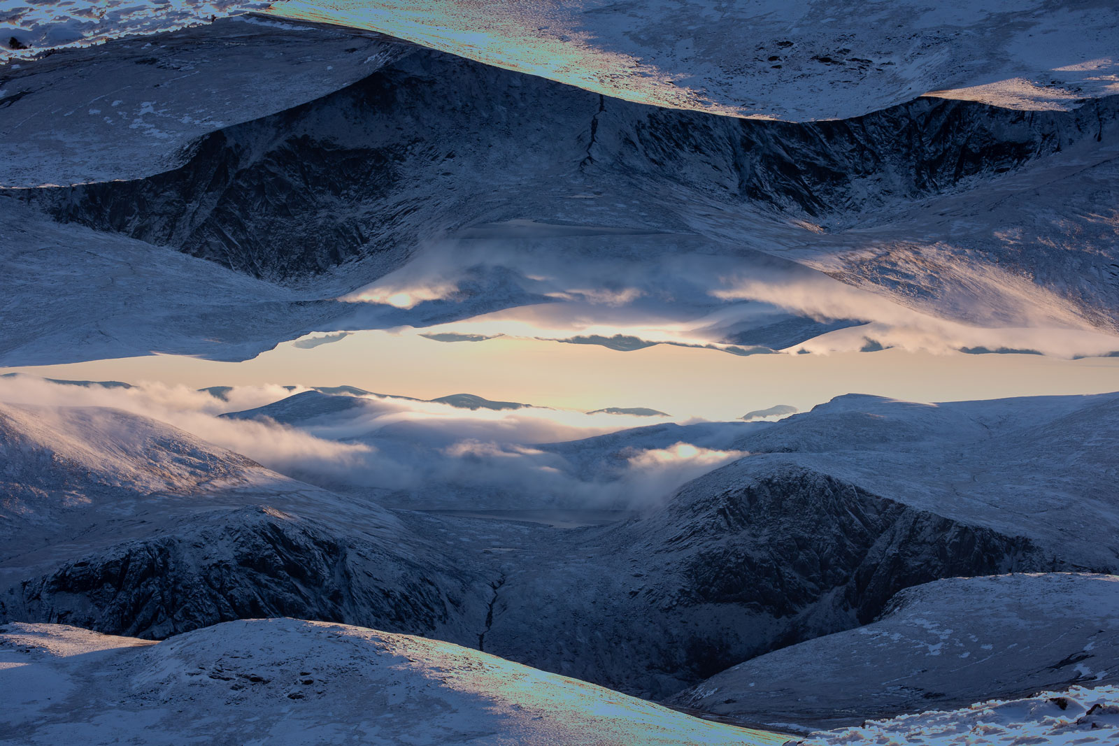 Photo of a snowboarder riding in the sun. 