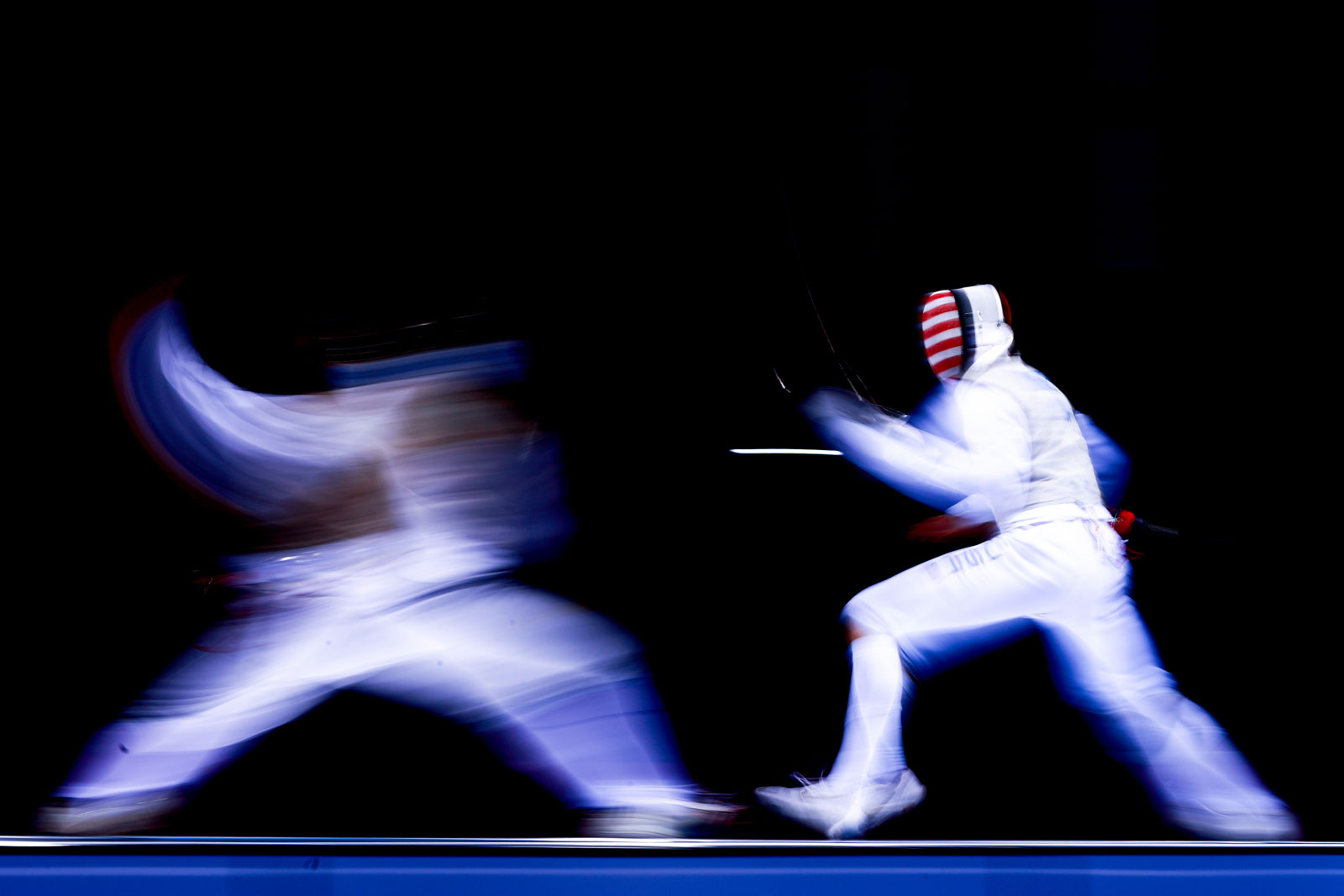 Foto van twee schermers in actie.