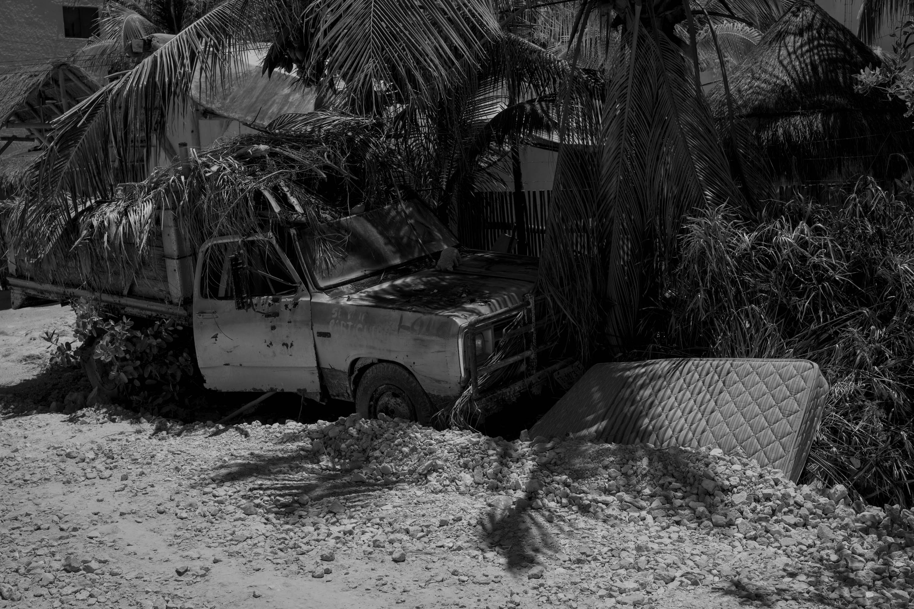 A black-and-white image of an old abandoned pickup truck in Mexico. By Ian Howorth.
