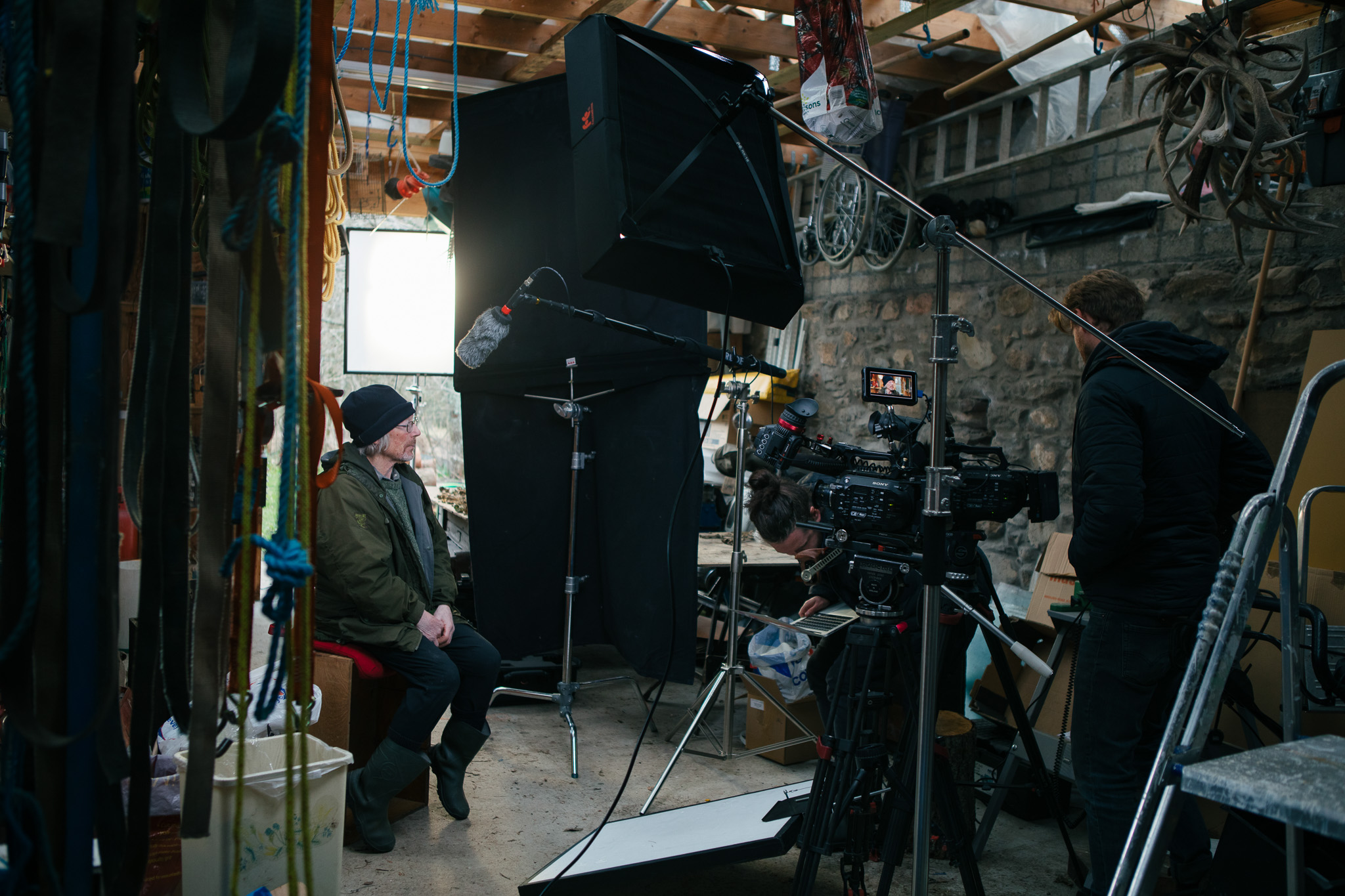Behind the scenes of an interview, with lots of gear visible