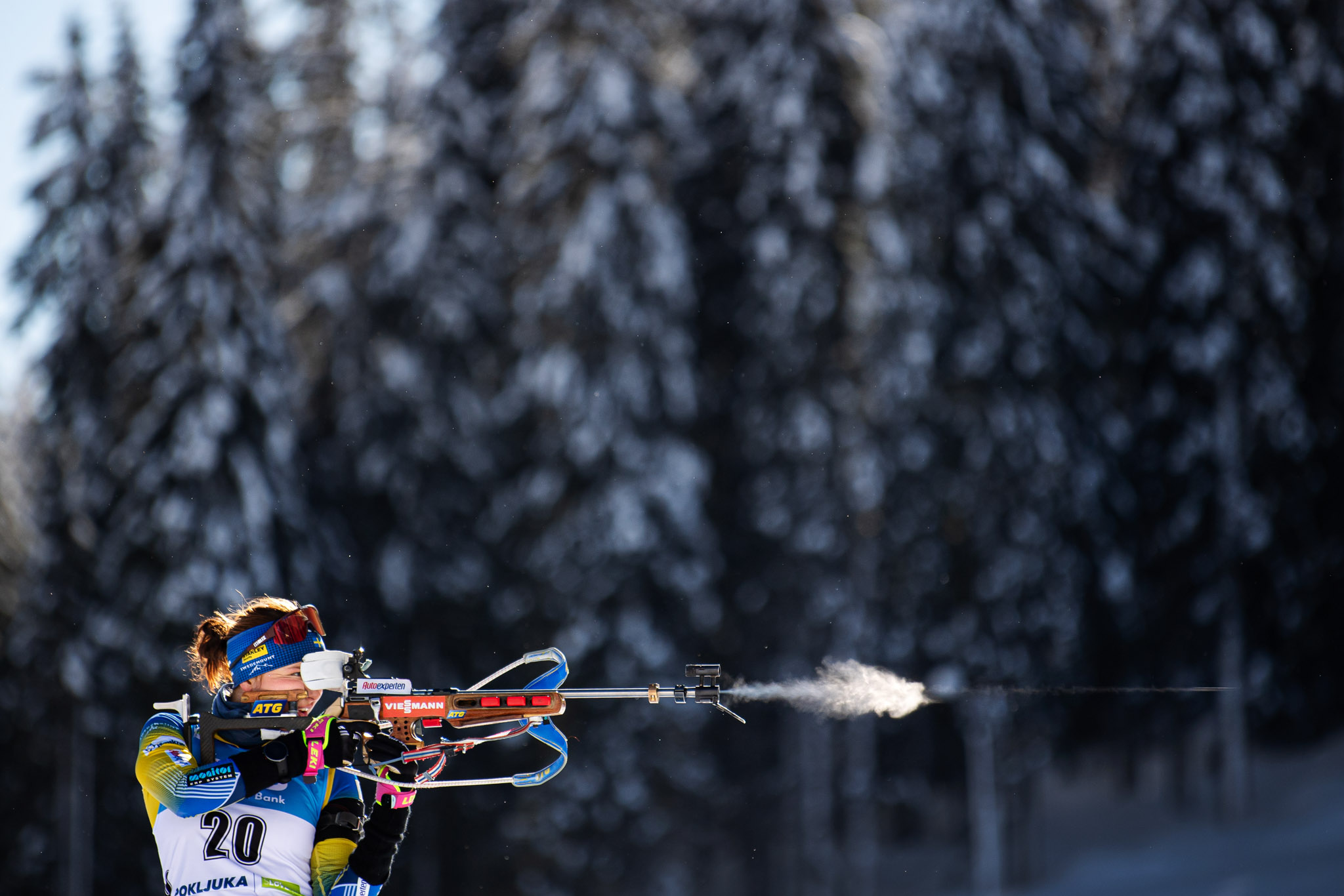 Linn Persson in the Biathlon World Championships firing a gun in winter