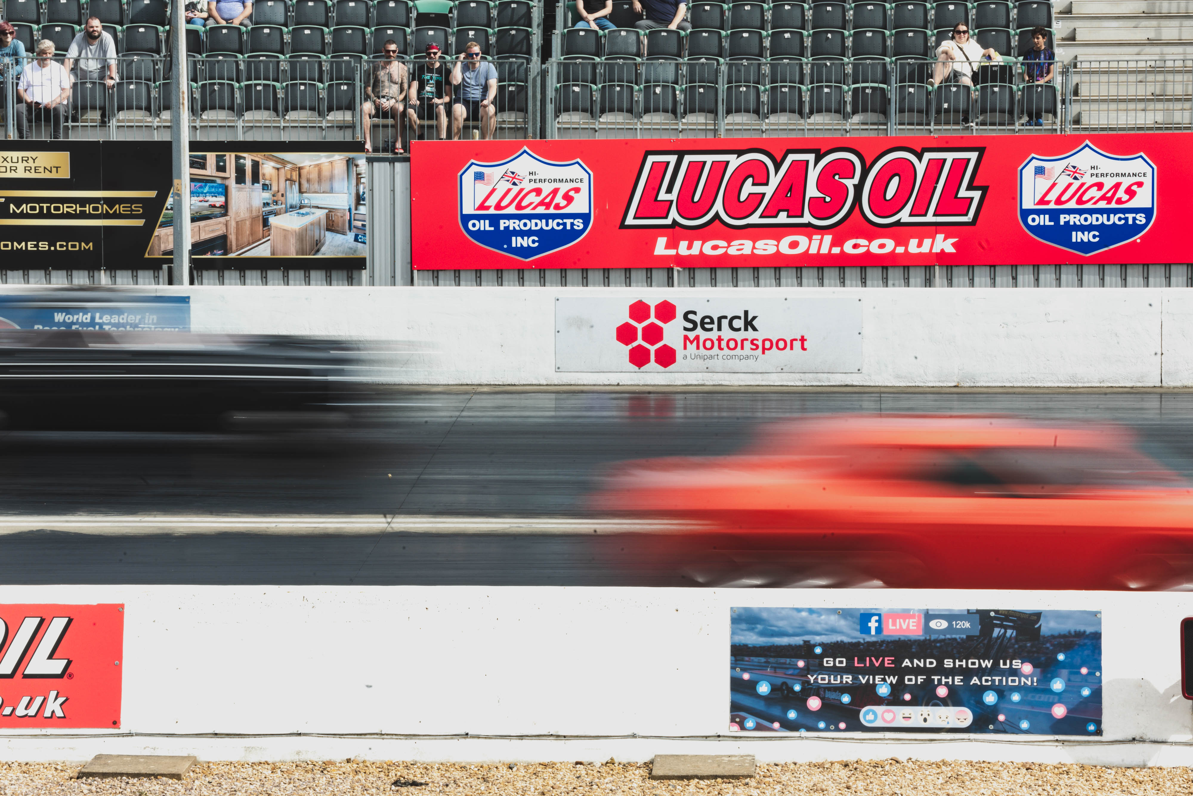 Two cars racing, out of focus