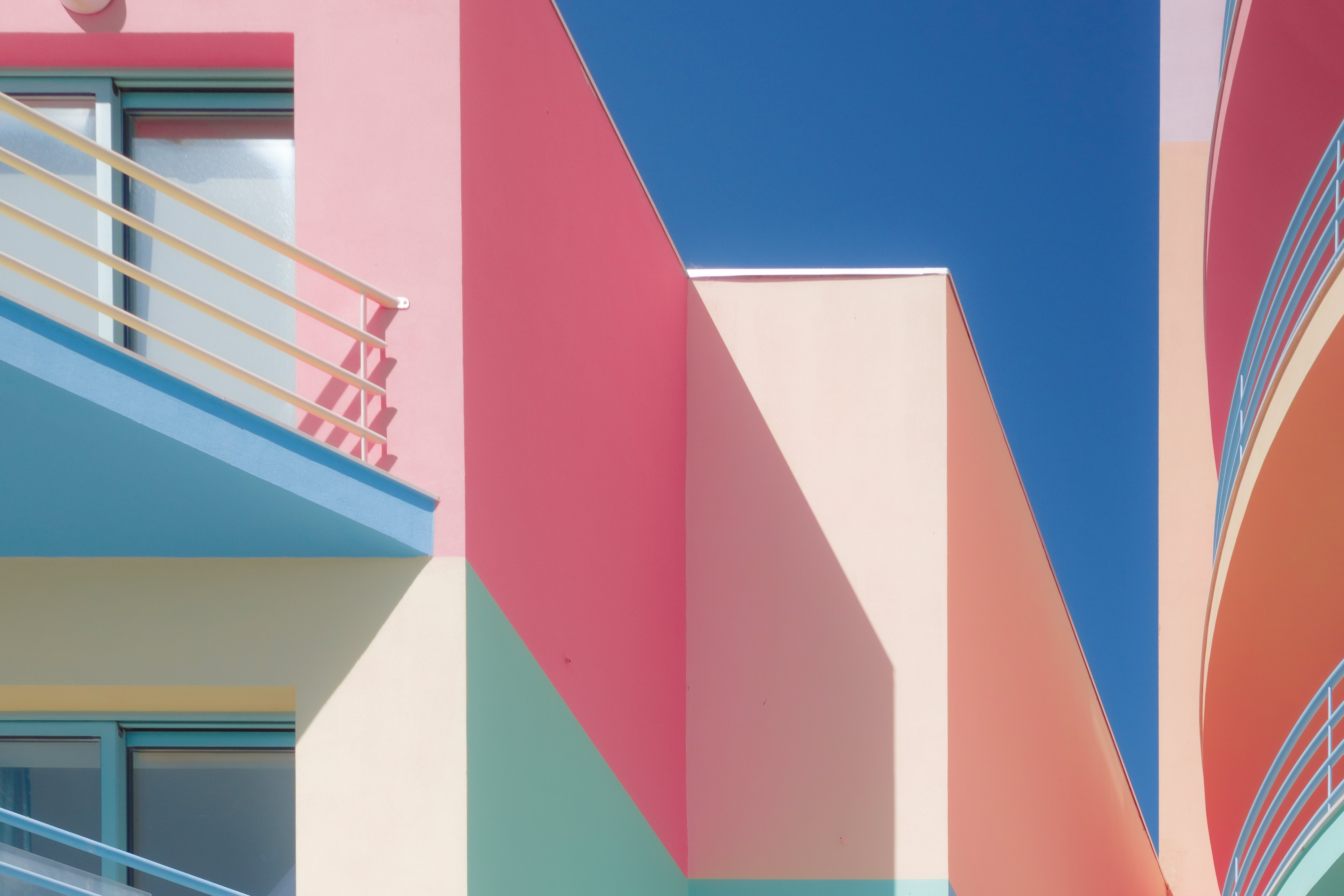 An almost abstract-looking image of vibrant pastel colours from an apartment building in Albufeira, Portugal. By Connor Redmond. 