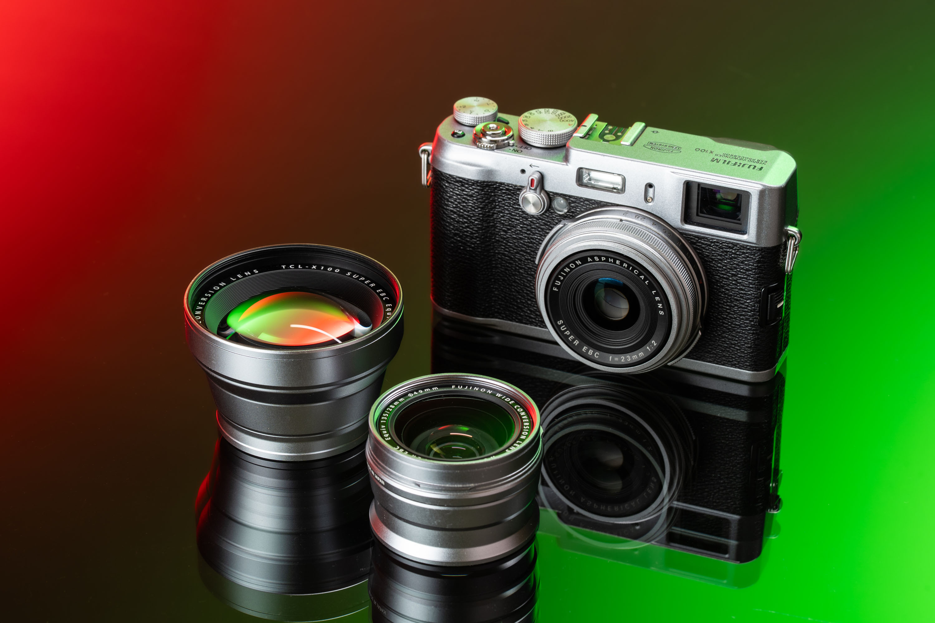 The Fujifilm X100 with two conversion lenses
