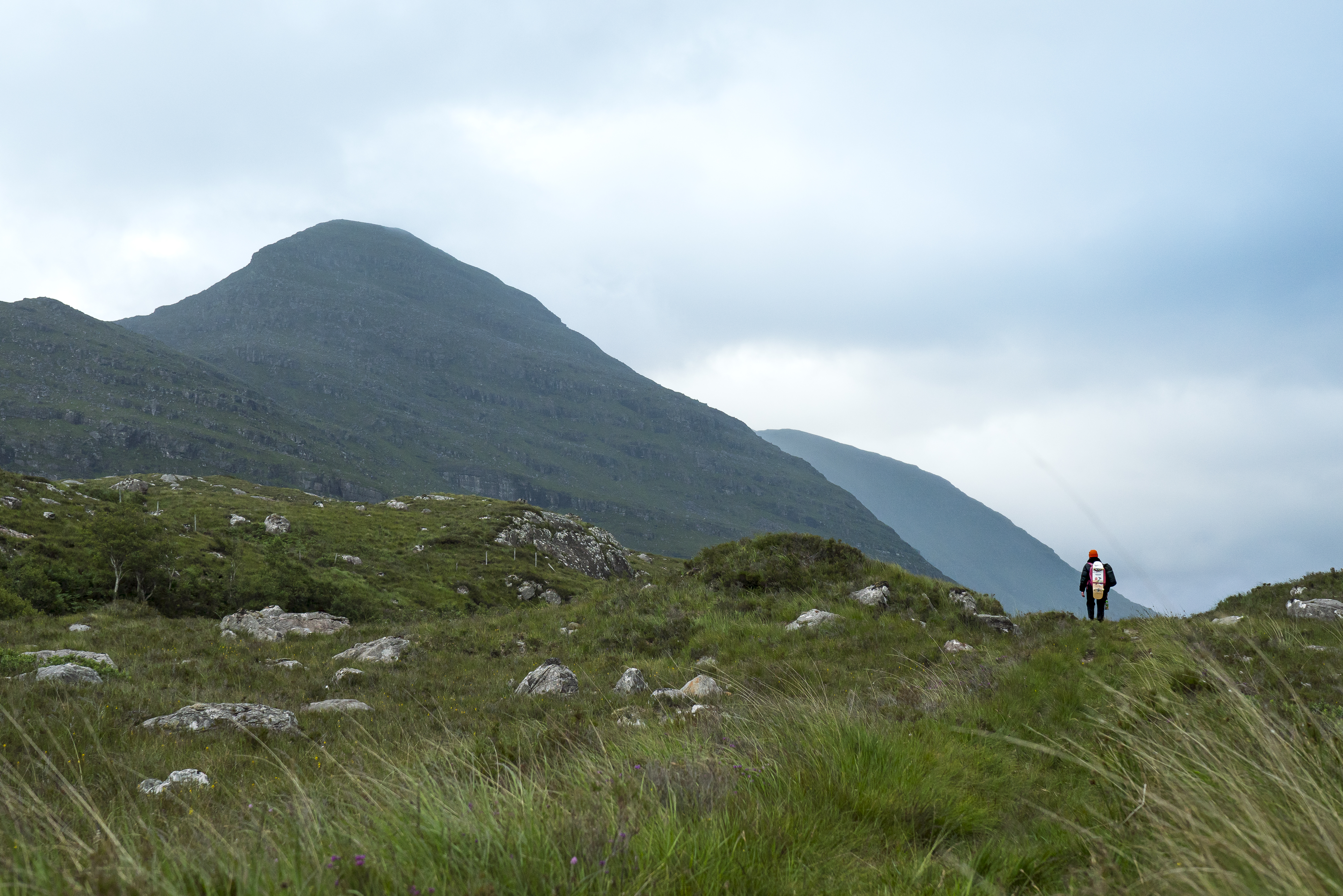 Skateboarder in the distance in the Scottish Highlands