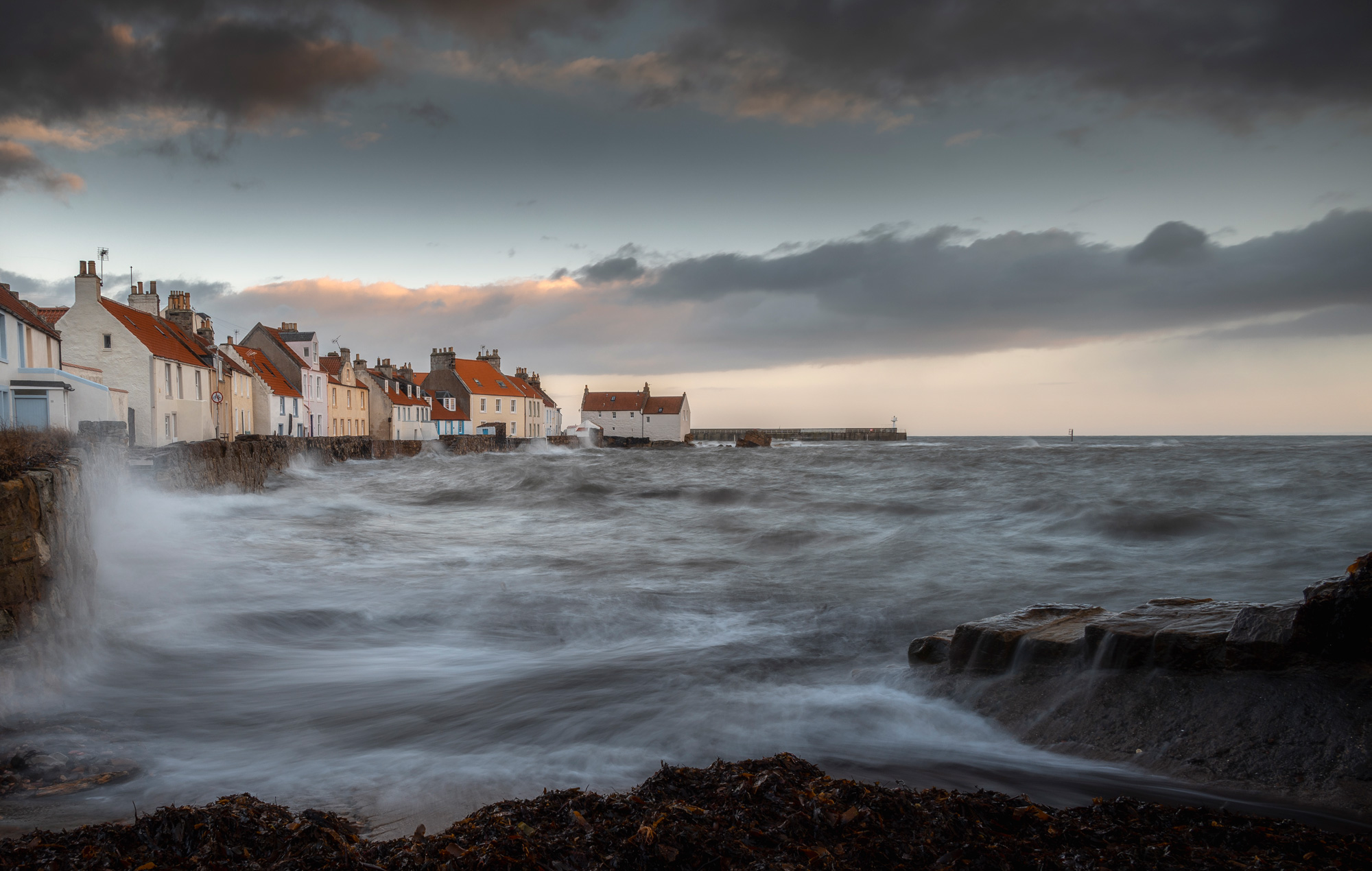 A wide-angle shot of the coastline of Pittenweem with houses in the middle distance, photo by Scott Jessiman with a Nikon Z6 II