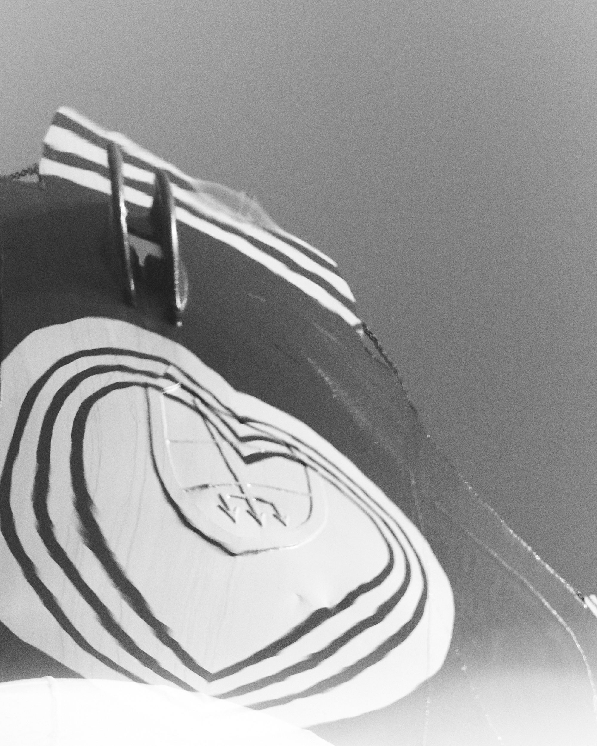 Black and white image of the sail of the Humanity 1 from a frog's-eye view.