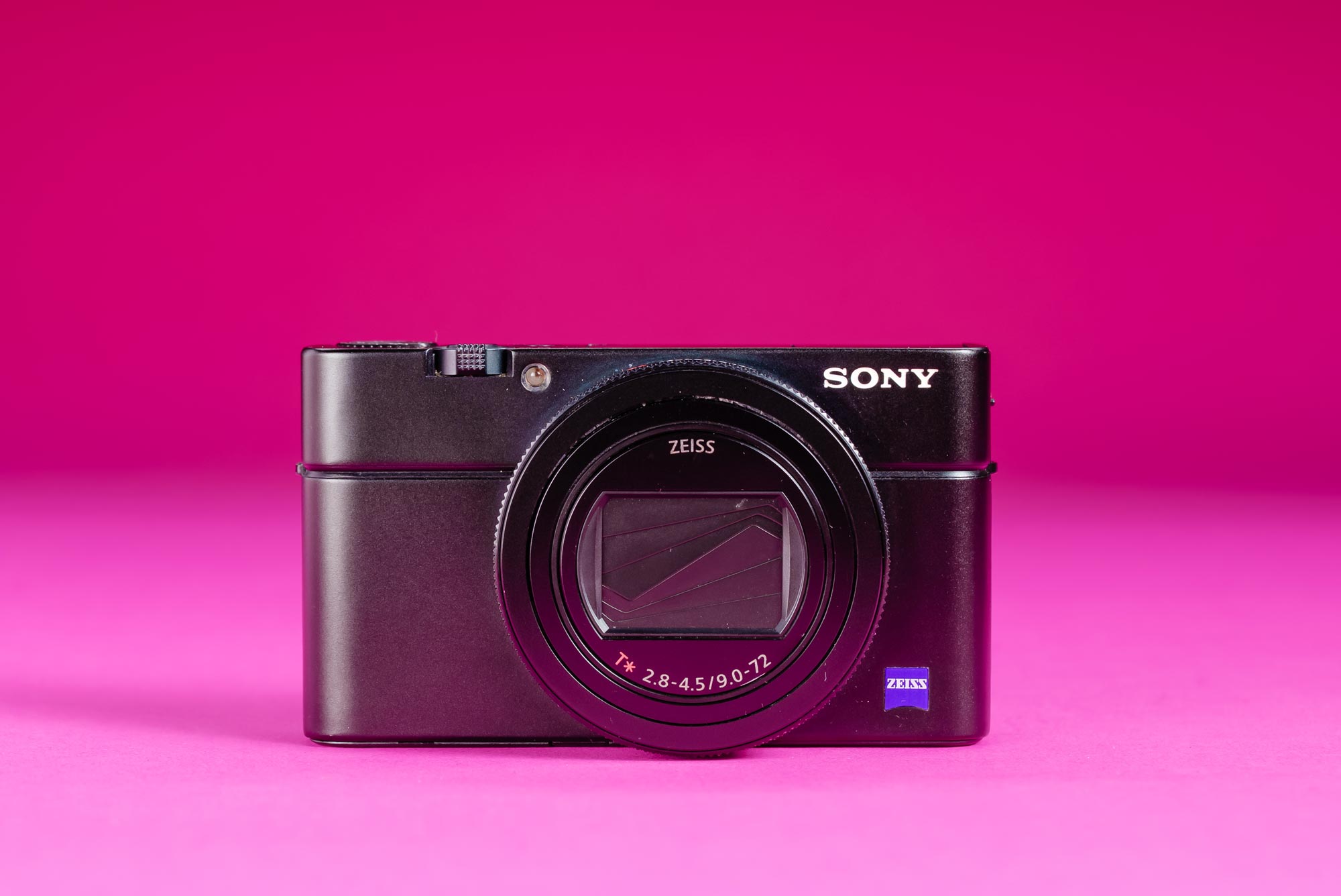 A used Sony RX100 VII on a graduated pink background.