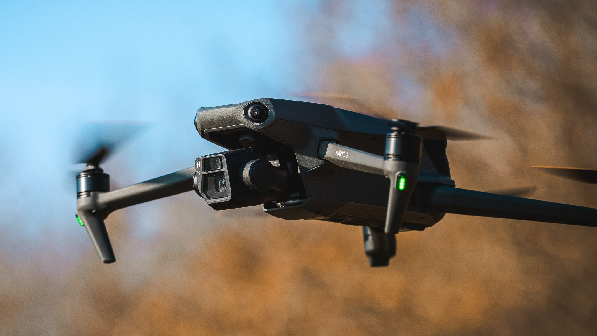 DJI Mavic 3 drone in flight, featuring the dual camera system and stabilised gimbal during outdoor flying.